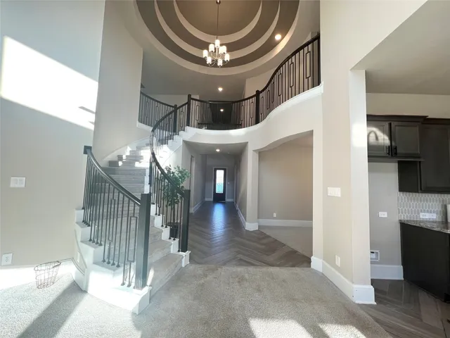 a view of a hallway view with staircase