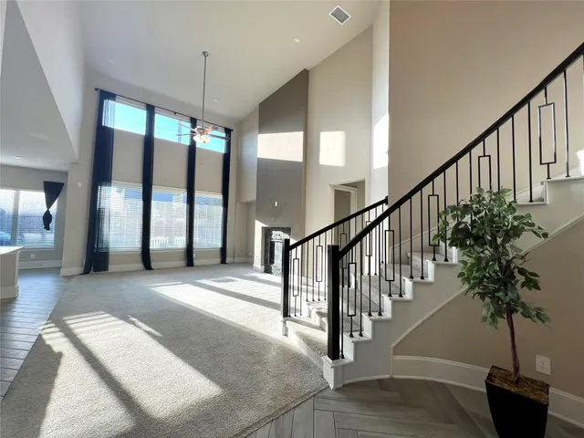 a view of staircase with lots of frames and flower