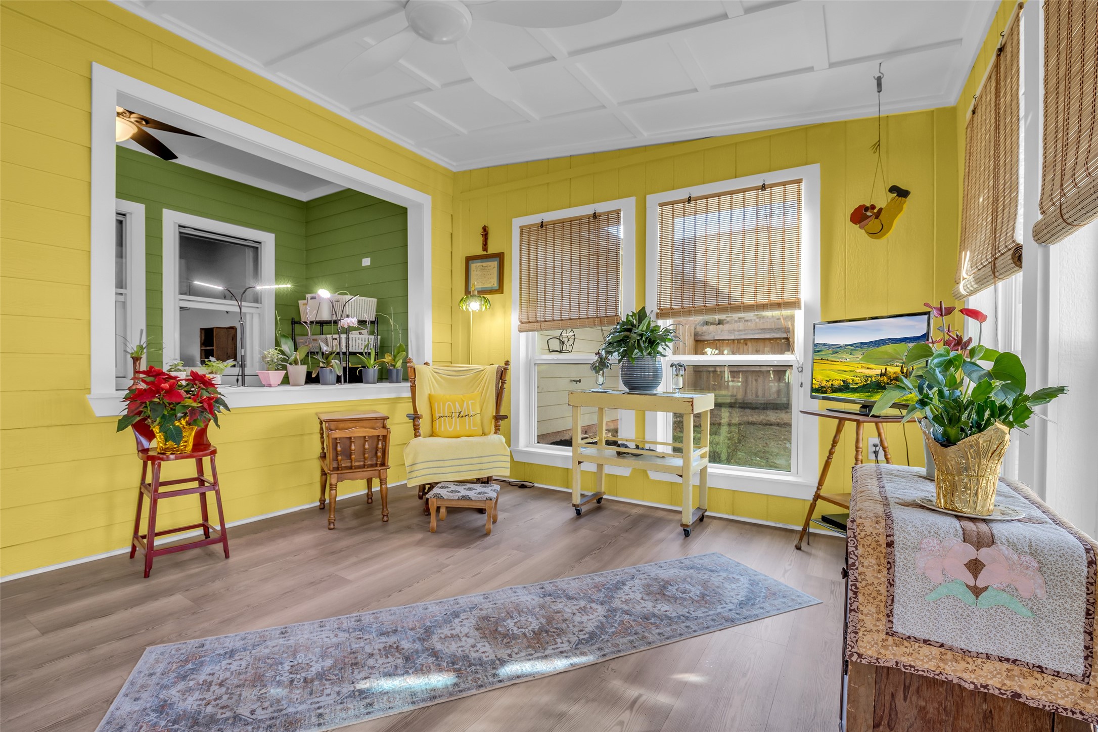 242 Sunset Path North Conroe, TX 77316 - Photo 16 of 37 Recent addition to the home -- this bright and cheerful sunroom. Walls of windows, open to flex and living areas. Ceiling Fan. Notice the ceiling trim! Glass door leads to outdoor patio. 242 SUNSET PATH N - Request your tour today!