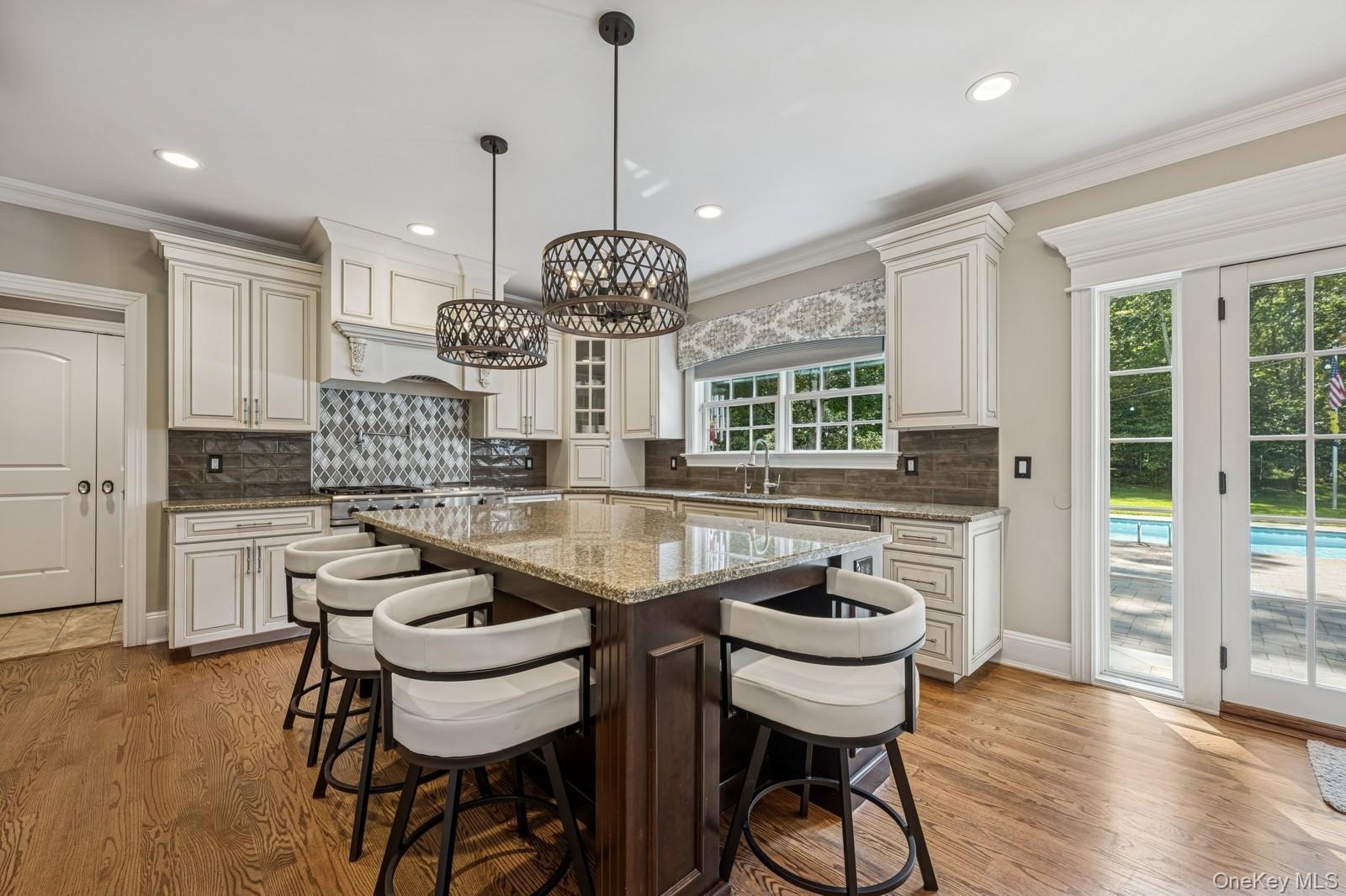 33 Bacon Road St. James, NY 11780 - Photo 12 of 48 a view of a dining room with furniture window and wooden floor