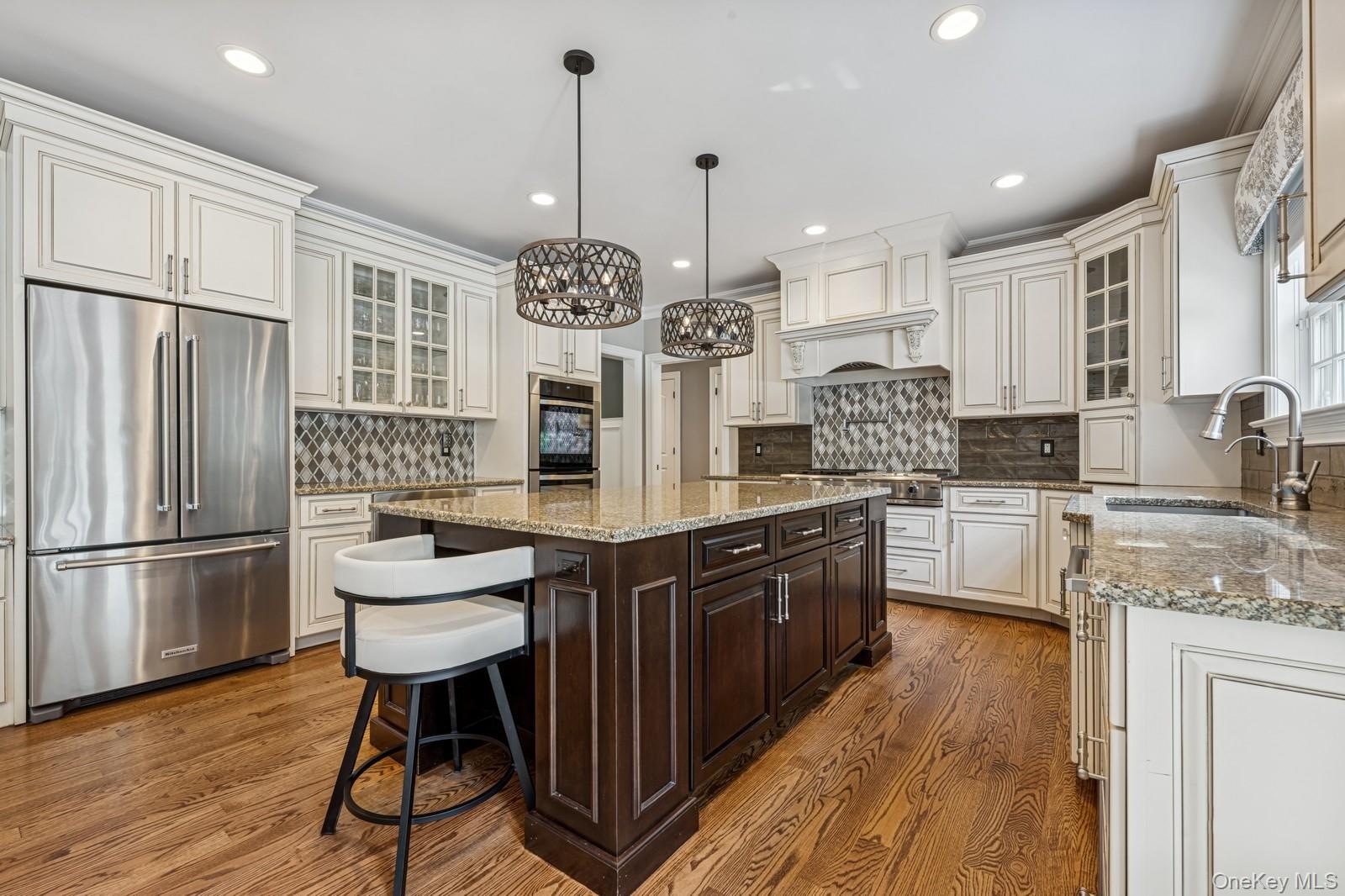 33 Bacon Road St. James, NY 11780 - Photo 13 of 48 a kitchen with stainless steel appliances granite countertop a sink stove and refrigerator