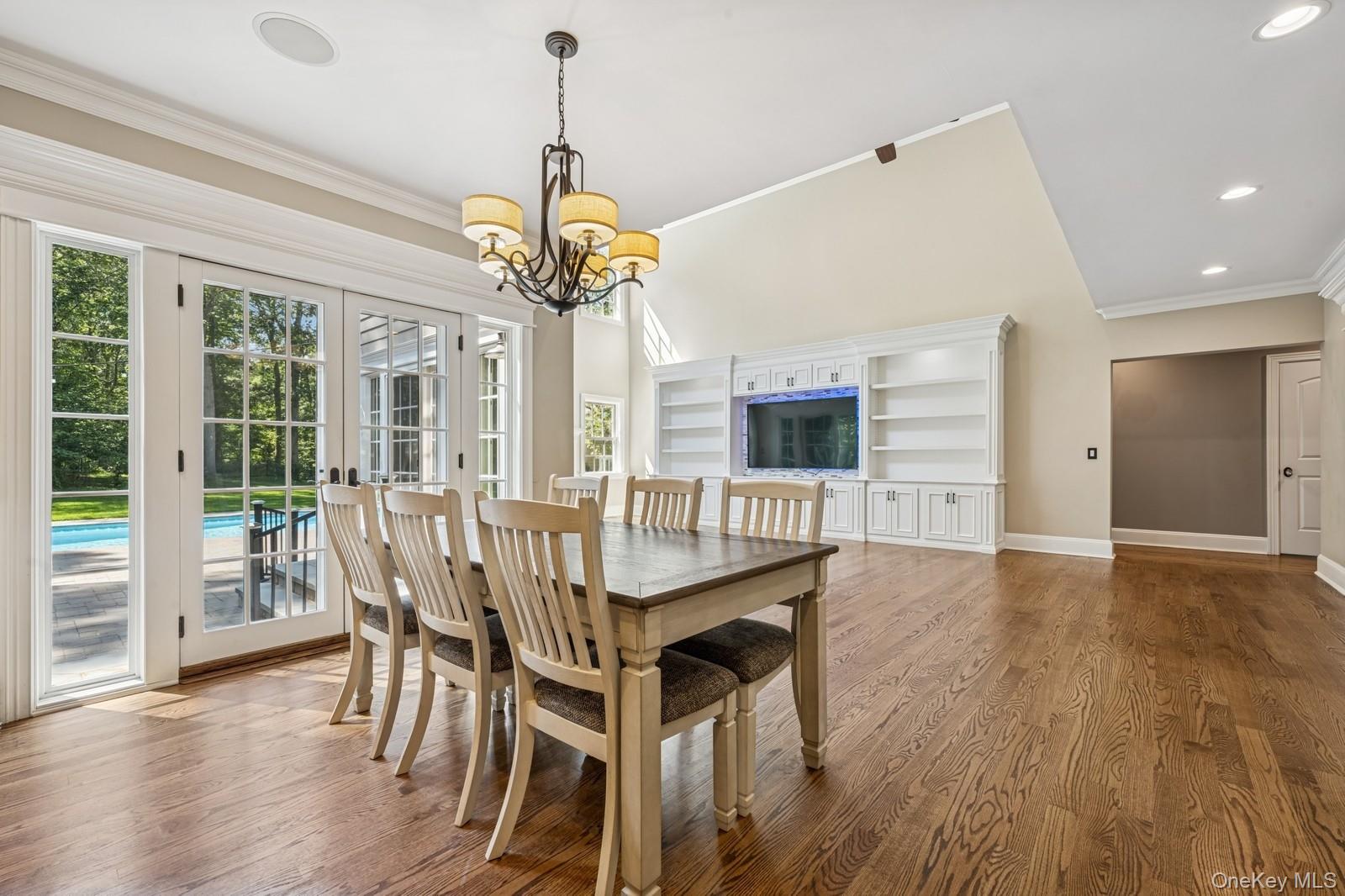 33 Bacon Road St. James, NY 11780 - Photo 16 of 48 a view of a dining room with furniture window and wooden floor