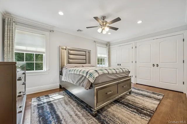 a bedroom with a large bed and a window