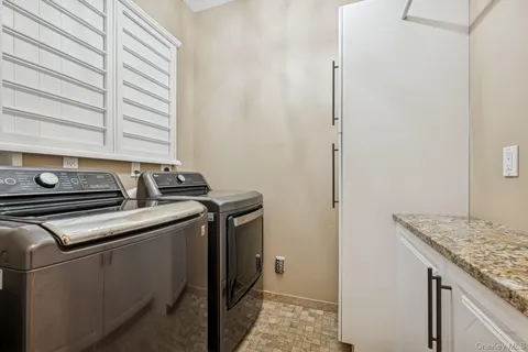 a utility room with washer and dryer