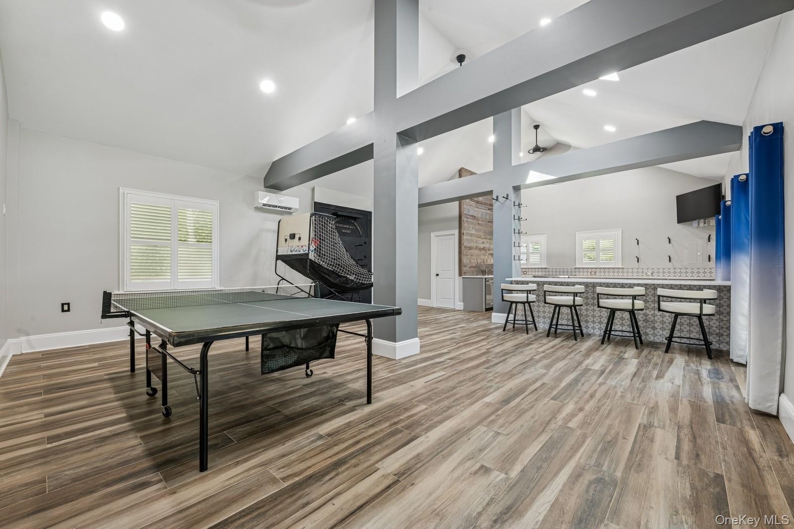 33 Bacon Road St. James, NY 11780 - Photo 36 of 48 a living room with furniture a table and kitchen view