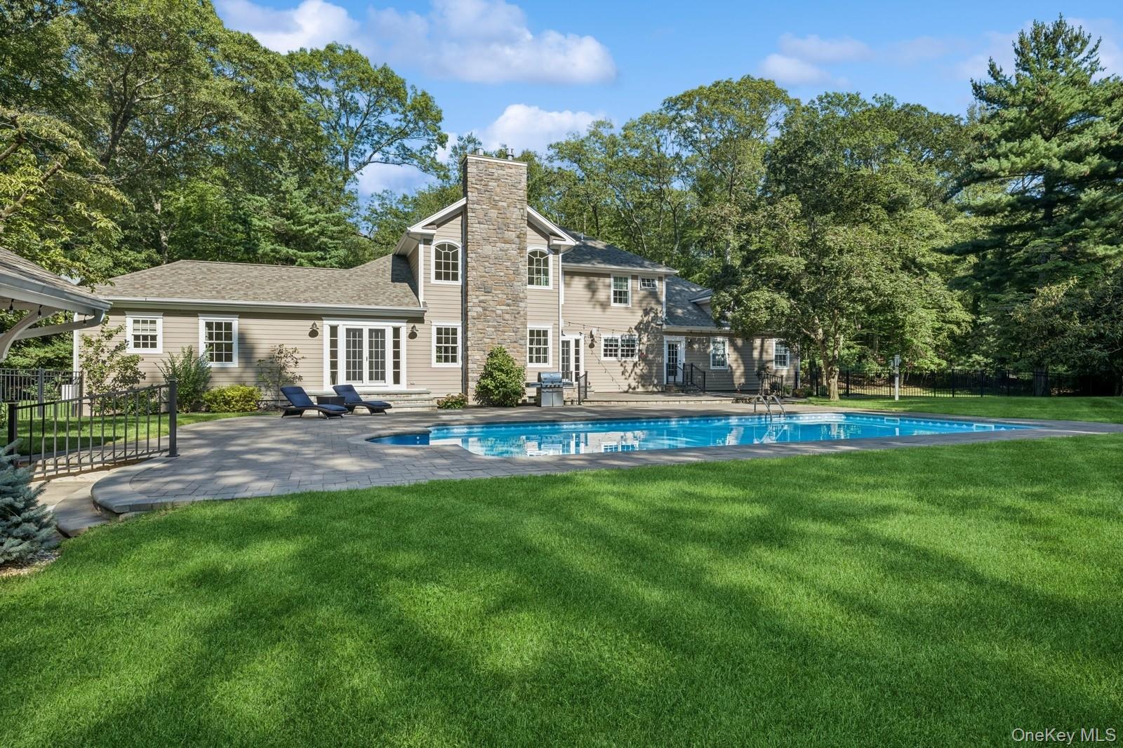 33 Bacon Road St. James, NY 11780 - Photo 41 of 48 a house view with a garden space