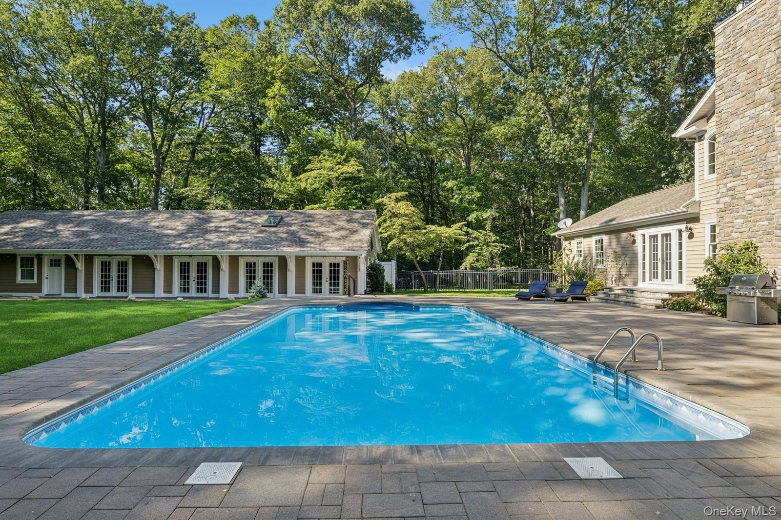 33 Bacon Road St. James, NY 11780 - Photo 43 of 48 a view of a house with backyard and sitting area