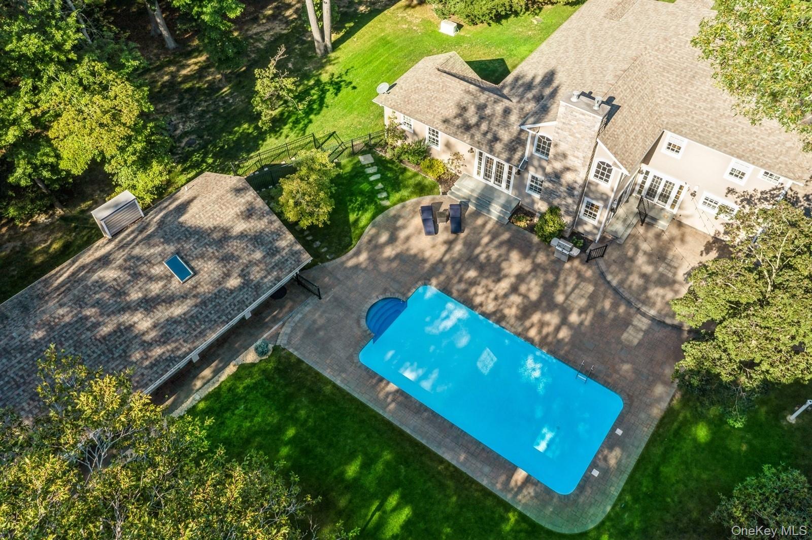 33 Bacon Road St. James, NY 11780 - Photo 45 of 48 an aerial view of a backyard