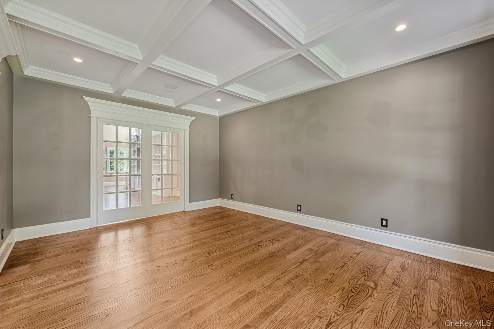 33 Bacon Road St. James, NY 11780 - Photo 6 of 48 wooden floor in an empty room with a window