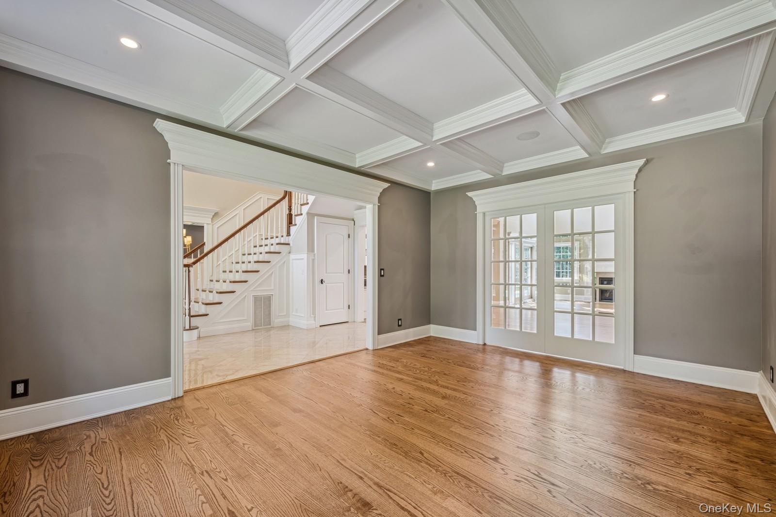 33 Bacon Road St. James, NY 11780 - Photo 7 of 48 wooden floor in an empty room with a window