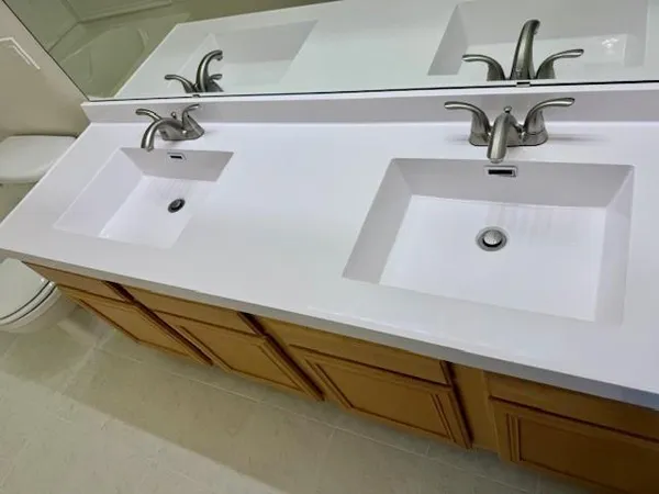 a bathroom with a sink and mirror