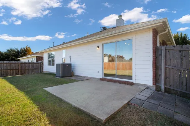 a view of a back yard of the house