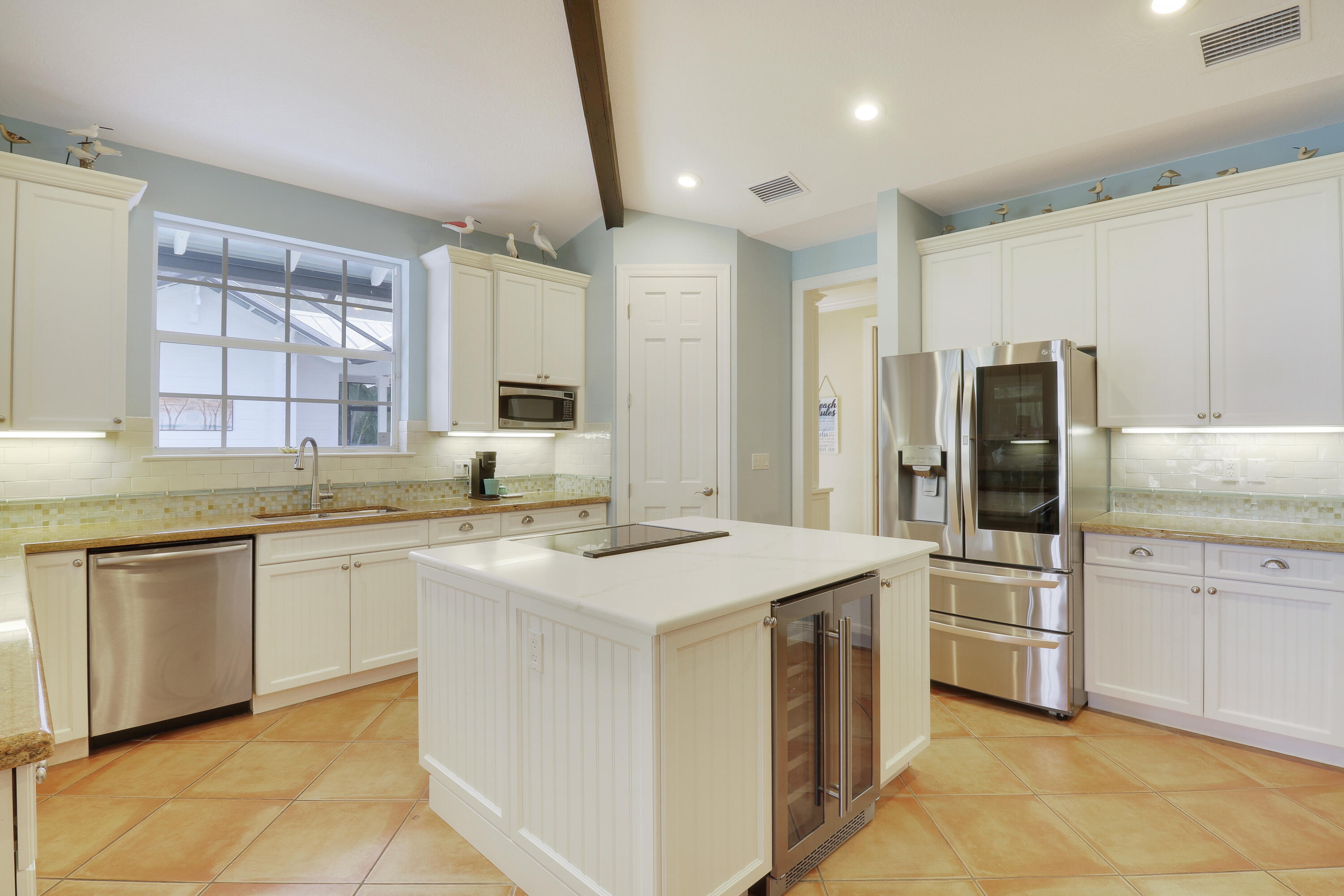 2416 Northwest Fork Road Stuart, FL 34994 - Photo 12 of 53 kitchen island with beverage fridge