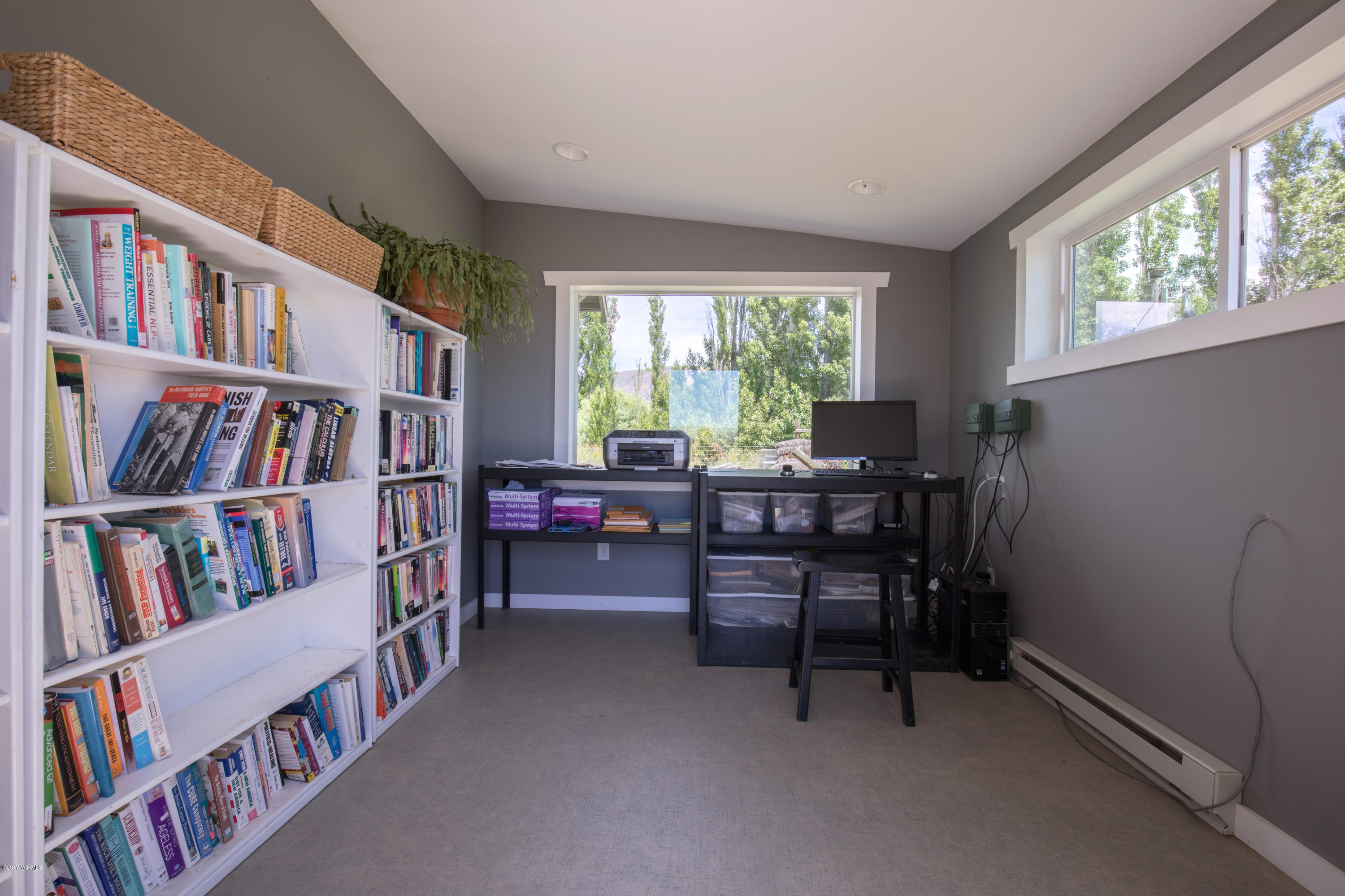 1091 Beffa Road Tieton, WA 98947 - Photo 14 of 34 a view of a workspace with furniture and a bookshelf