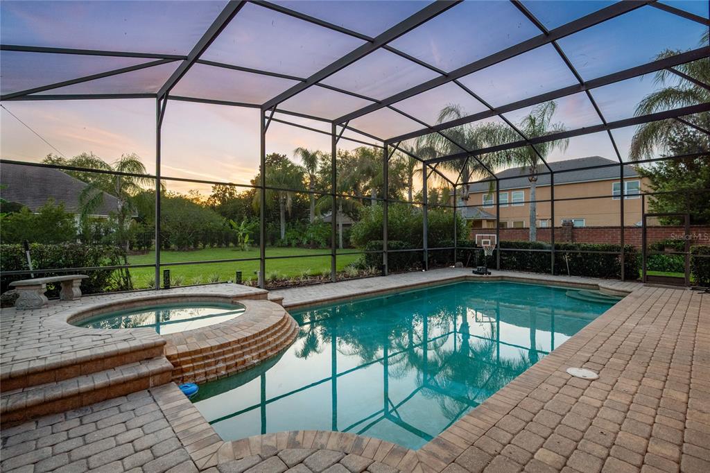 2002 Water Key Drive Windermere, FL 34786 - Photo 38 of 60 a view of a swimming pool with a patio