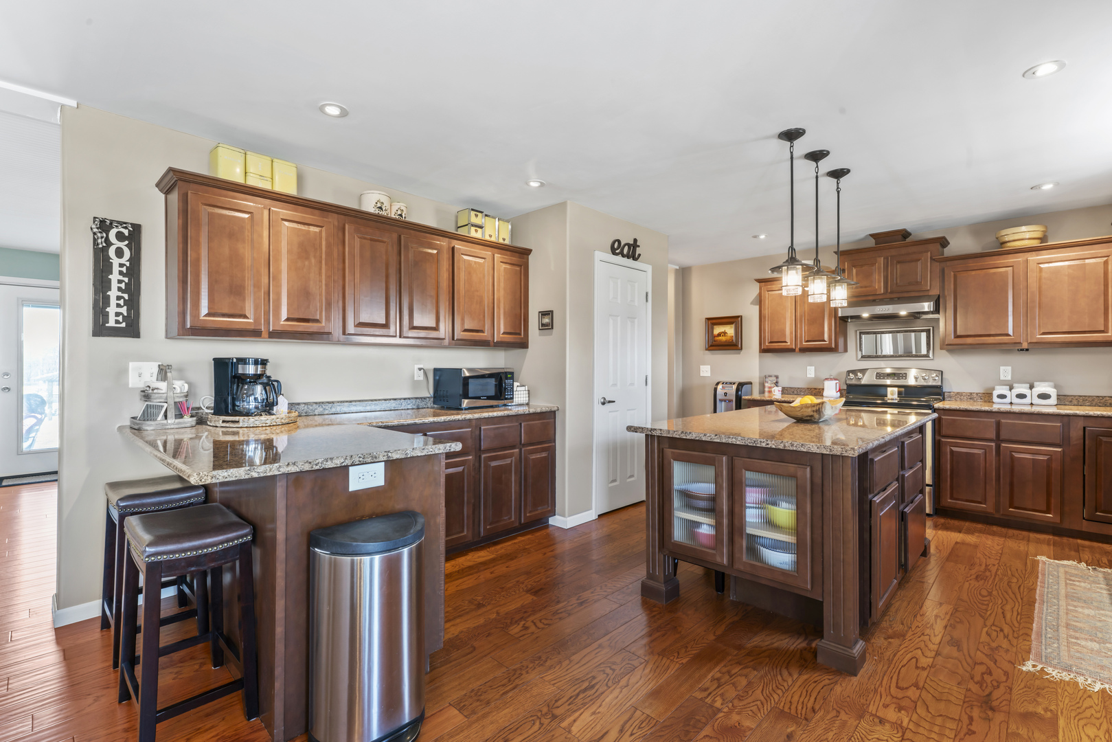 3015 North 1600 East Road Clifton, IL 60927 - Photo 15 of 46 a kitchen with stainless steel appliances granite countertop a table chairs and a refrigerator