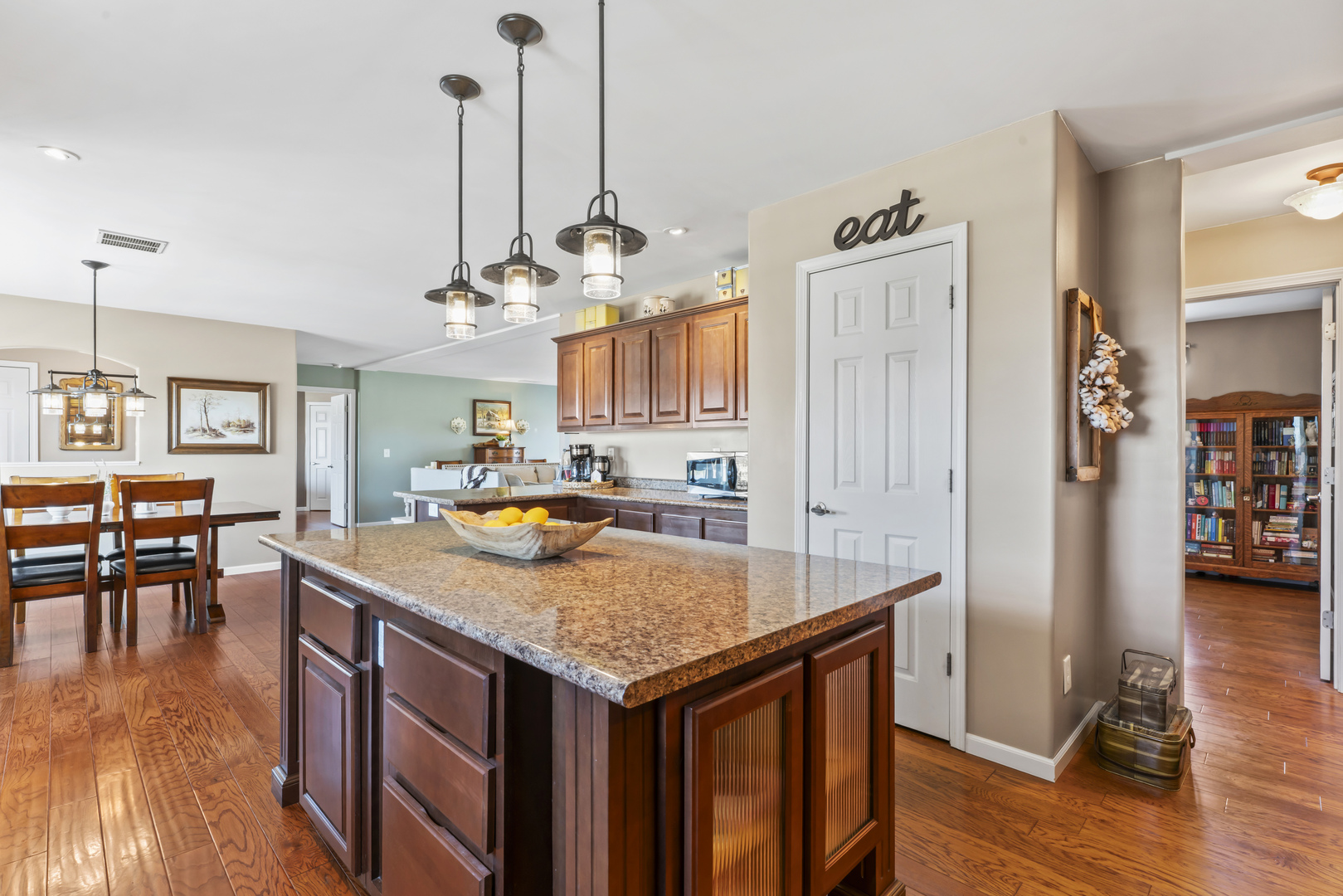 3015 North 1600 East Road Clifton, IL 60927 - Photo 17 of 46 a kitchen with stainless steel appliances granite countertop stove top oven and table