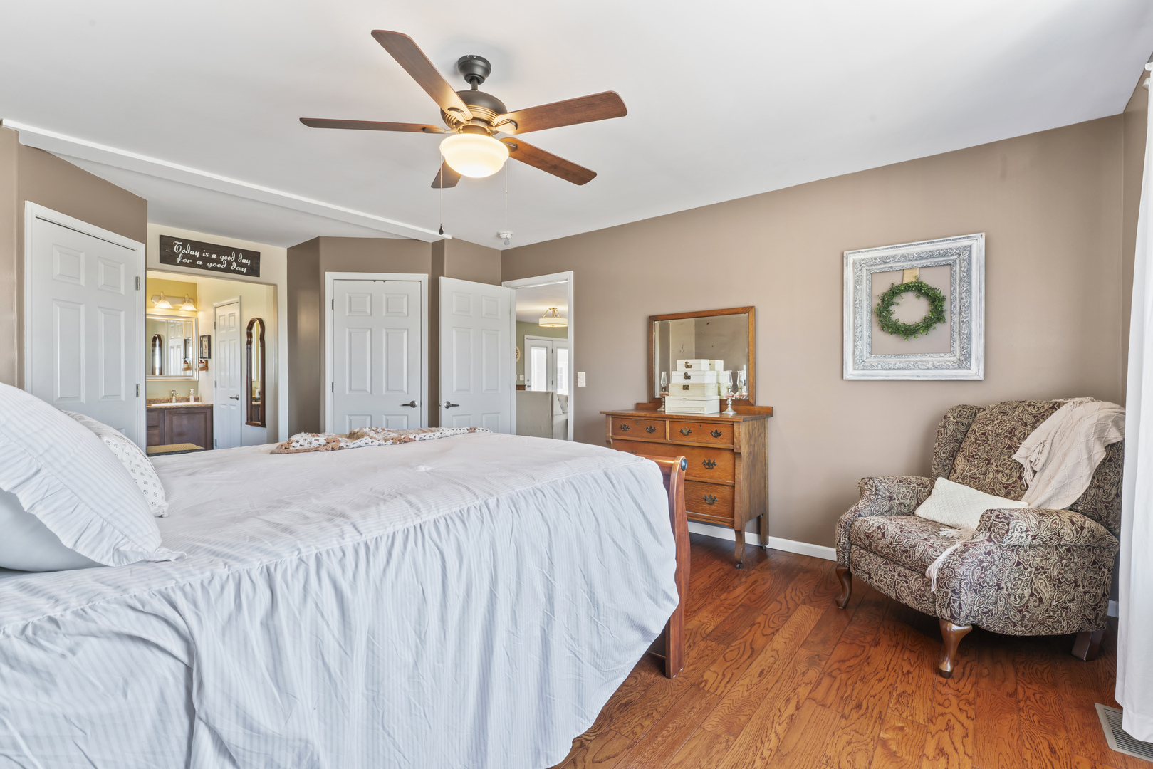 3015 North 1600 East Road Clifton, IL 60927 - Photo 20 of 46 a bedroom with a bed and wooden floor