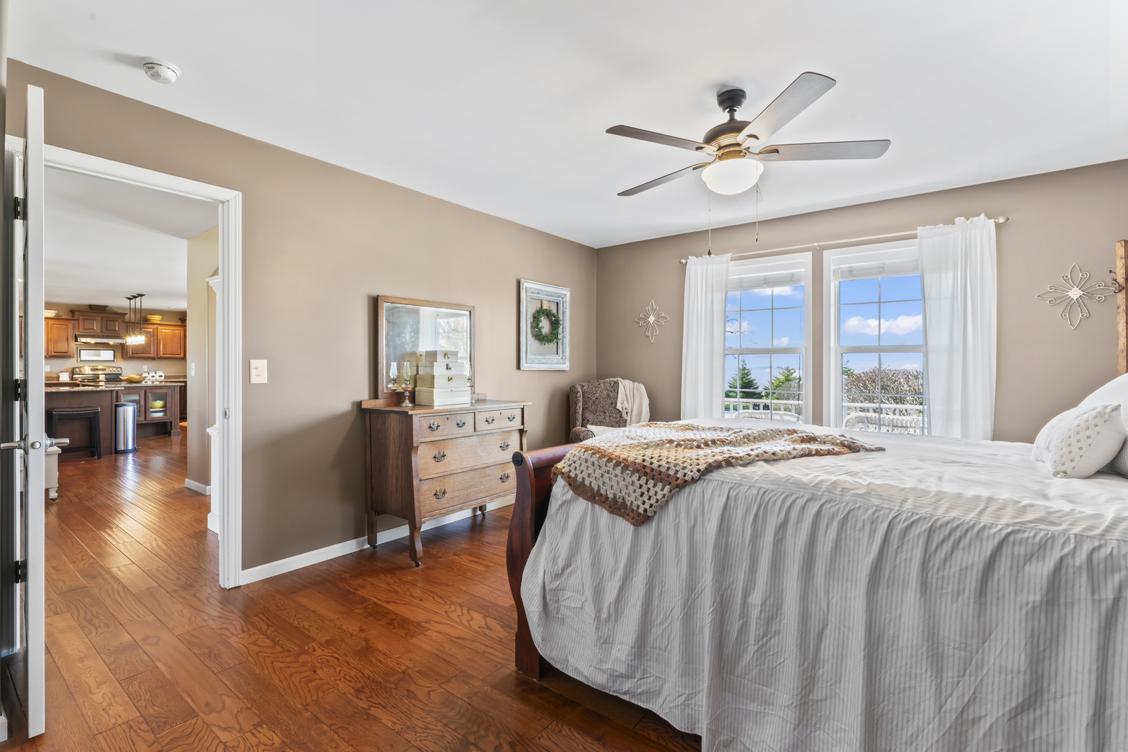 3015 North 1600 East Road Clifton, IL 60927 - Photo 21 of 46 a bed room with a bed and a chandelier