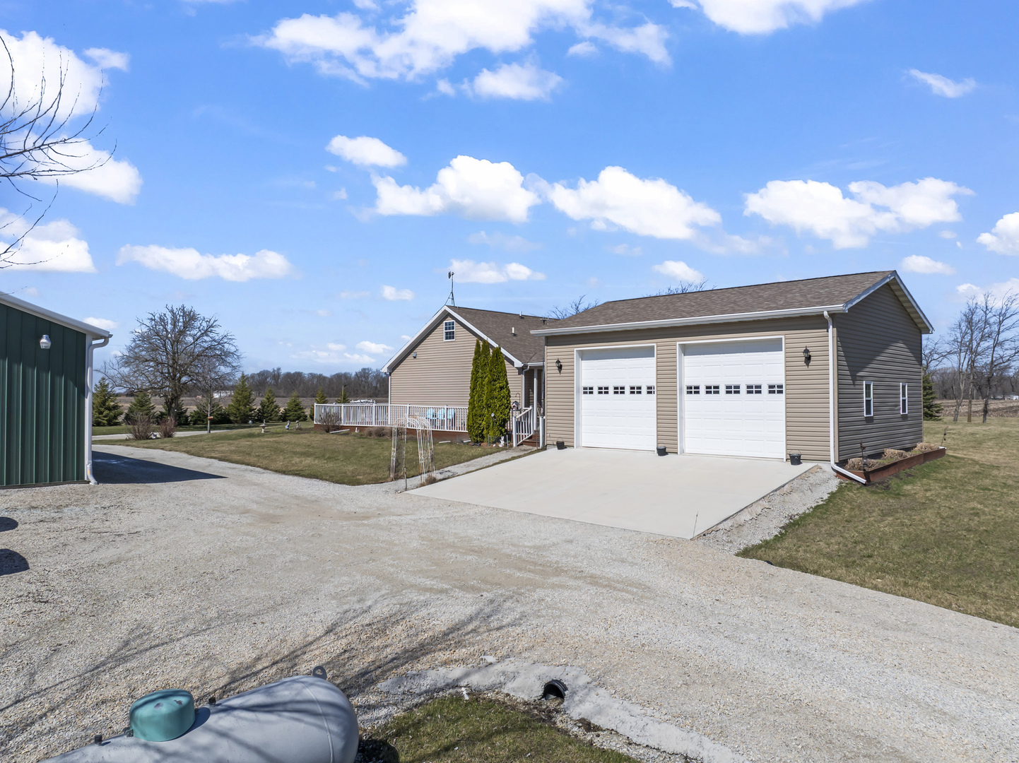 3015 North 1600 East Road Clifton, IL 60927 - Photo 5 of 46 a view of yellow house with a big yard and large trees