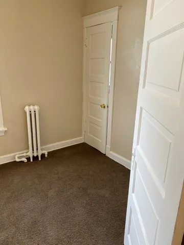 an empty room with a bench