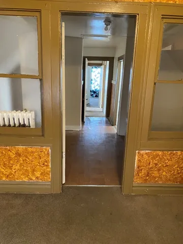 a view of an empty room and window