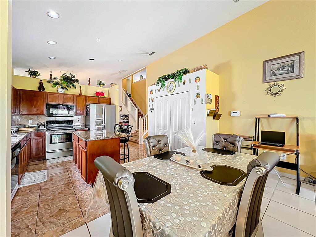 7939 Riffle Lane Orlando, FL 32818 - Photo 14 of 52 a view of a dining room with furniture
