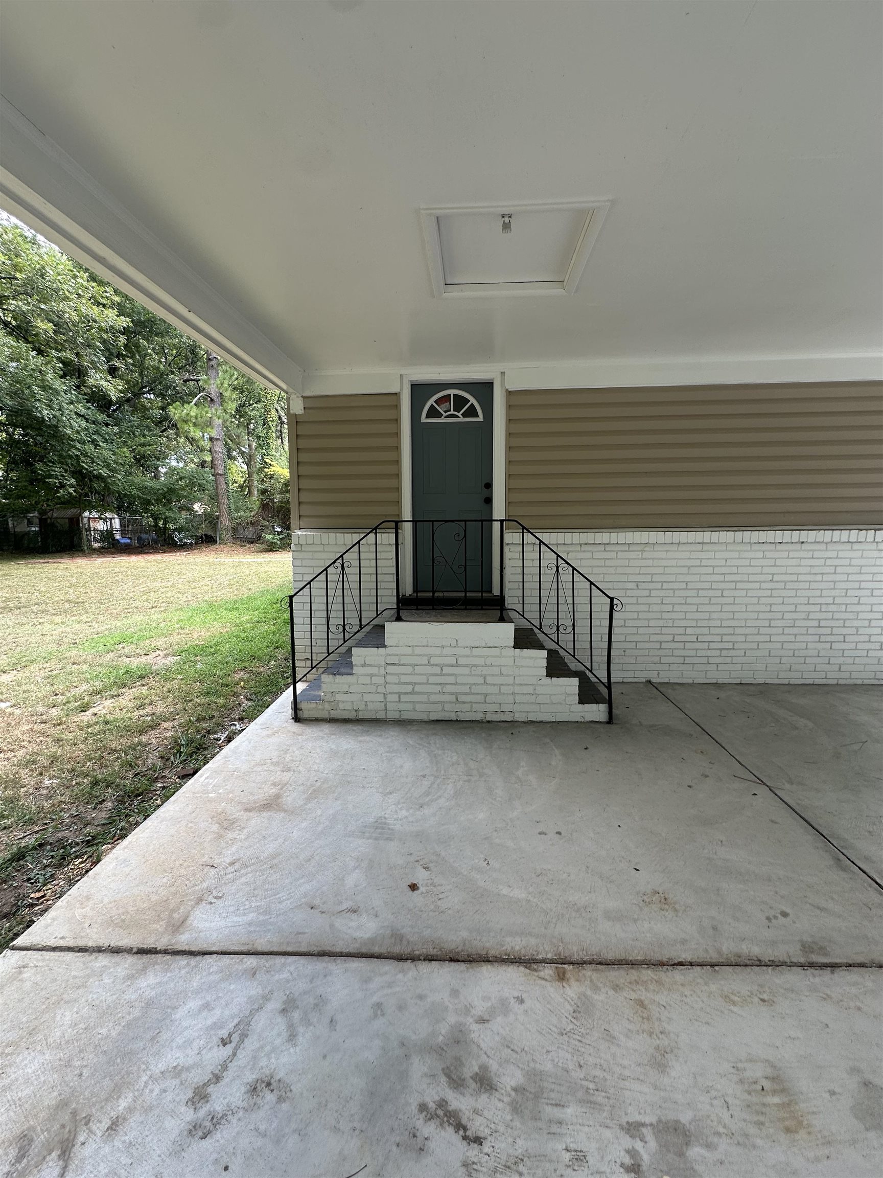 3402 Lakeview Road Memphis, TN 38116 - Photo 24 of 30 View of exterior entry featuring a yard and brick siding