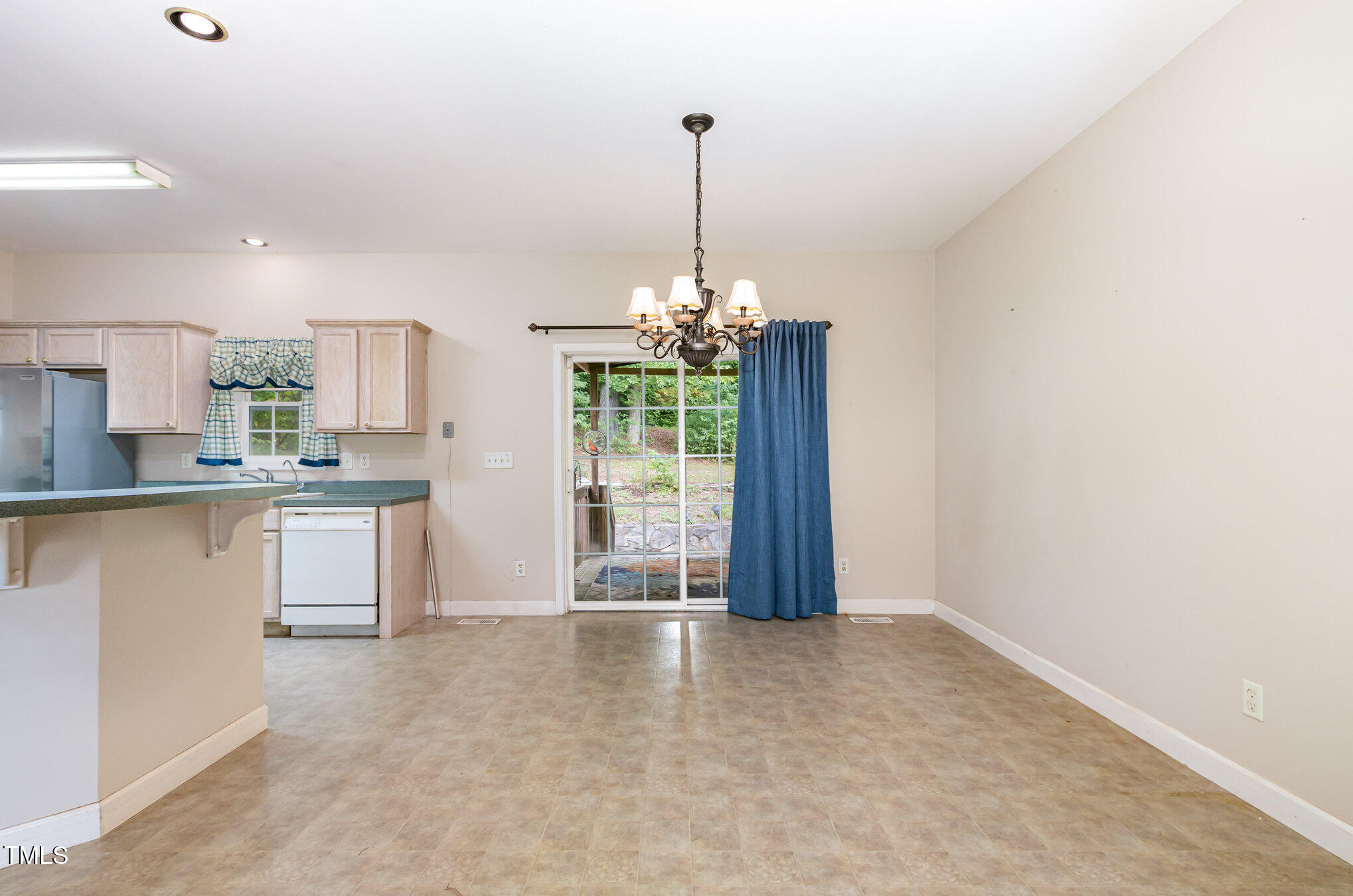 824 Kittrell Road Kittrell, NC 27544 - Photo 10 of 37 a kitchen with kitchen island a counter top space a sink and appliances