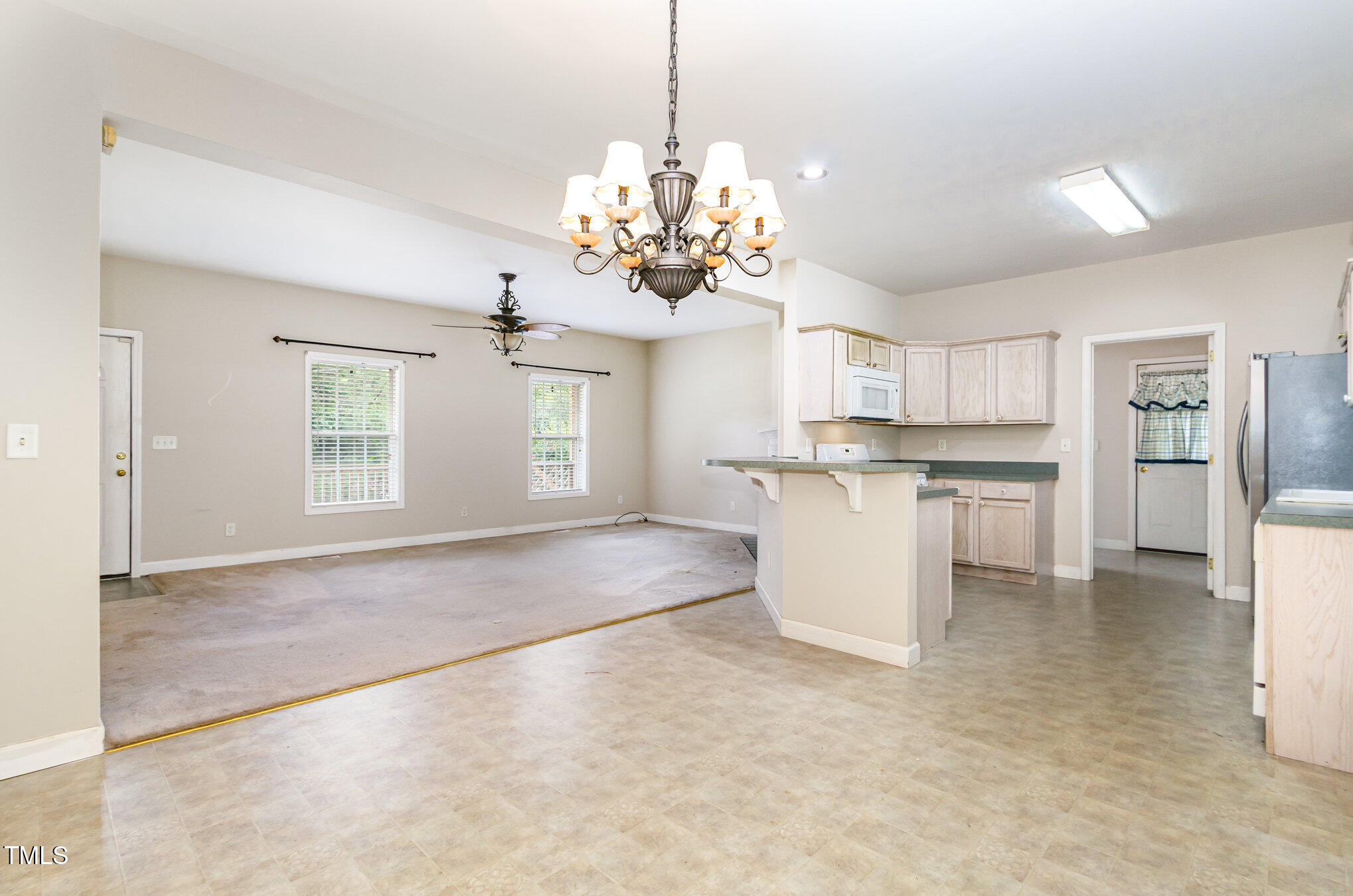 824 Kittrell Road Kittrell, NC 27544 - Photo 12 of 37 a view of a kitchen with refrigerator and window