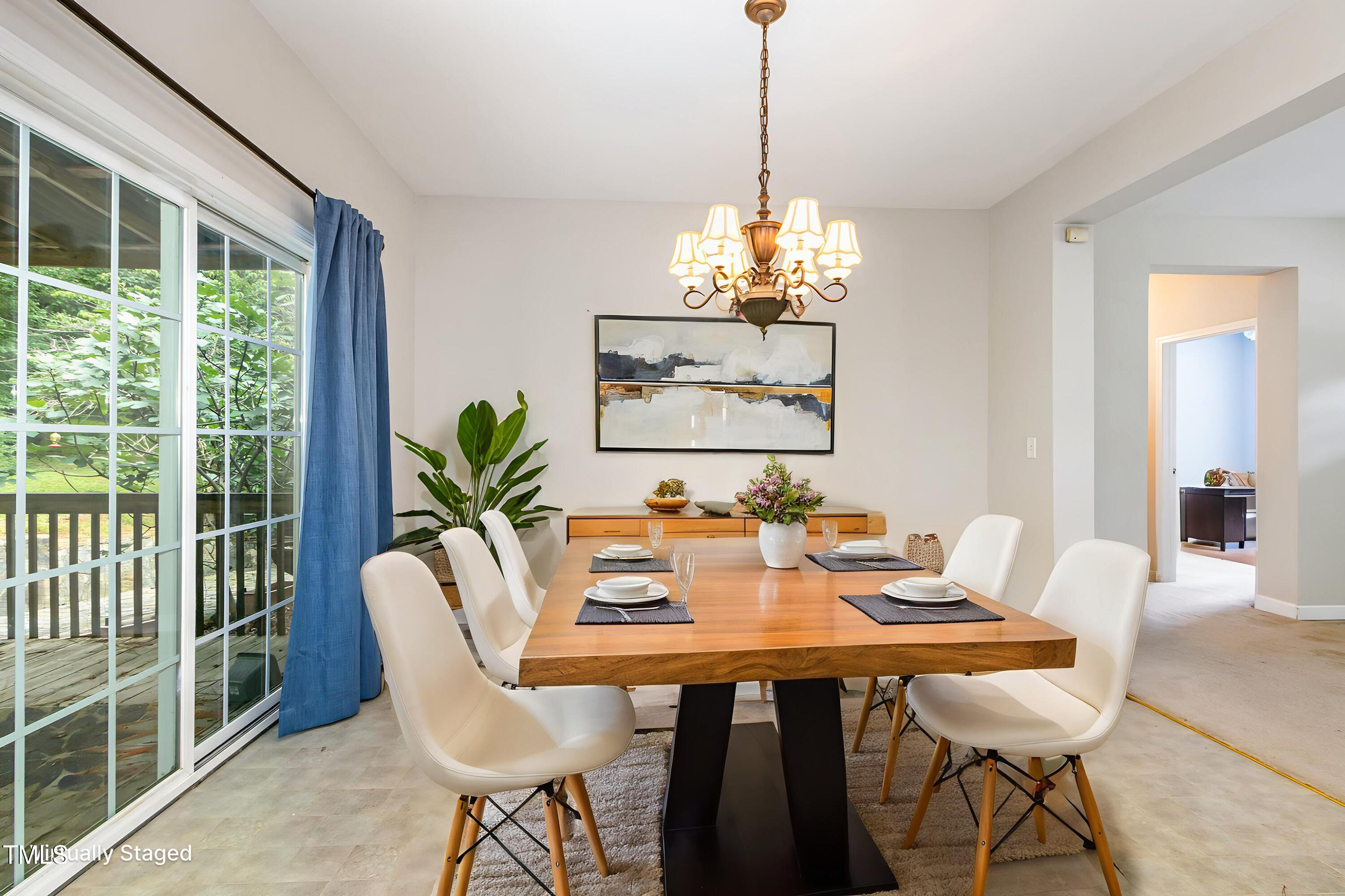 824 Kittrell Road Kittrell, NC 27544 - Photo 14 of 37 a view of a dining room with furniture wooden floor and chandelier