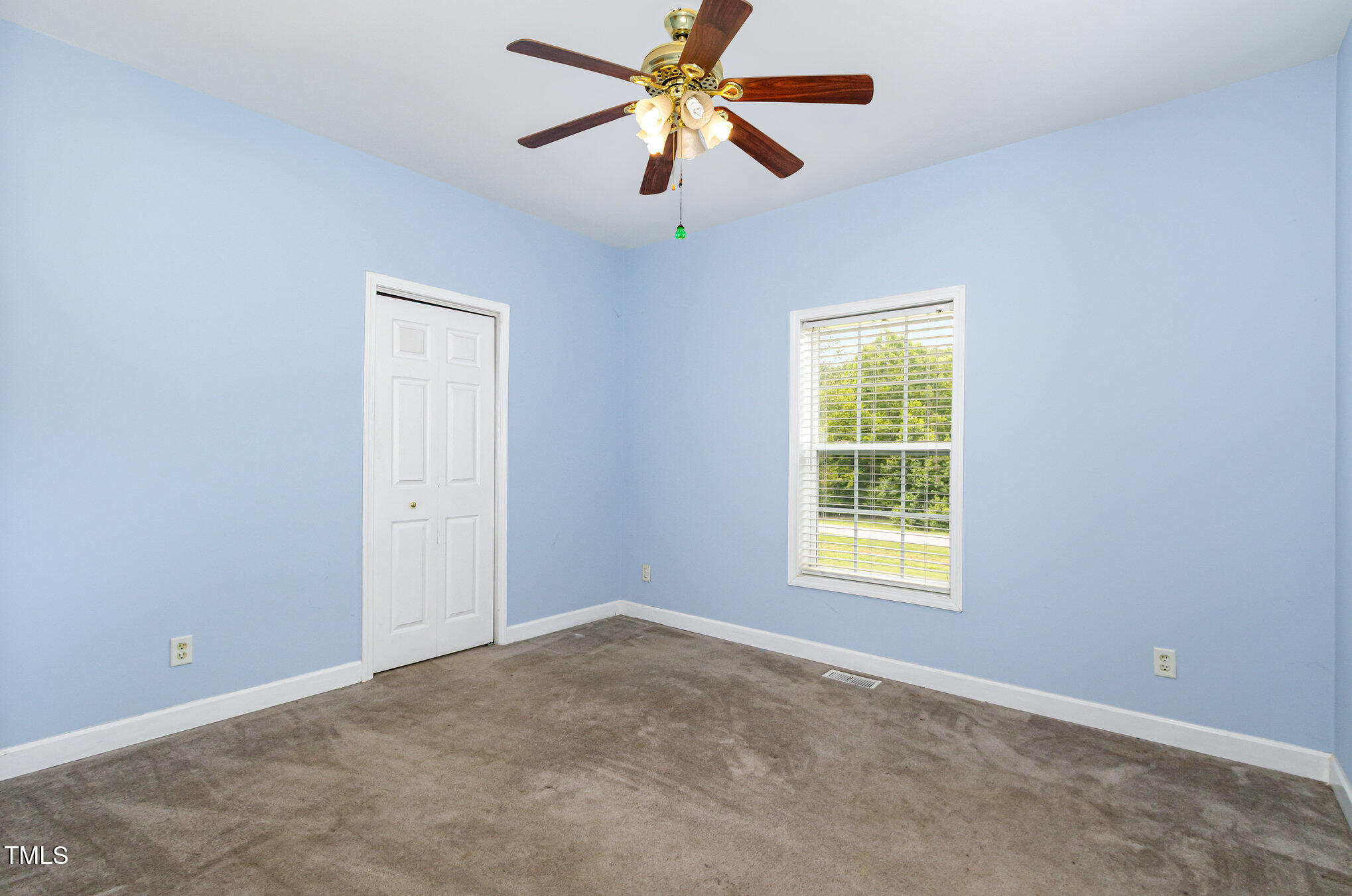 824 Kittrell Road Kittrell, NC 27544 - Photo 21 of 37 a view of a livingroom with a window and a ceiling fan