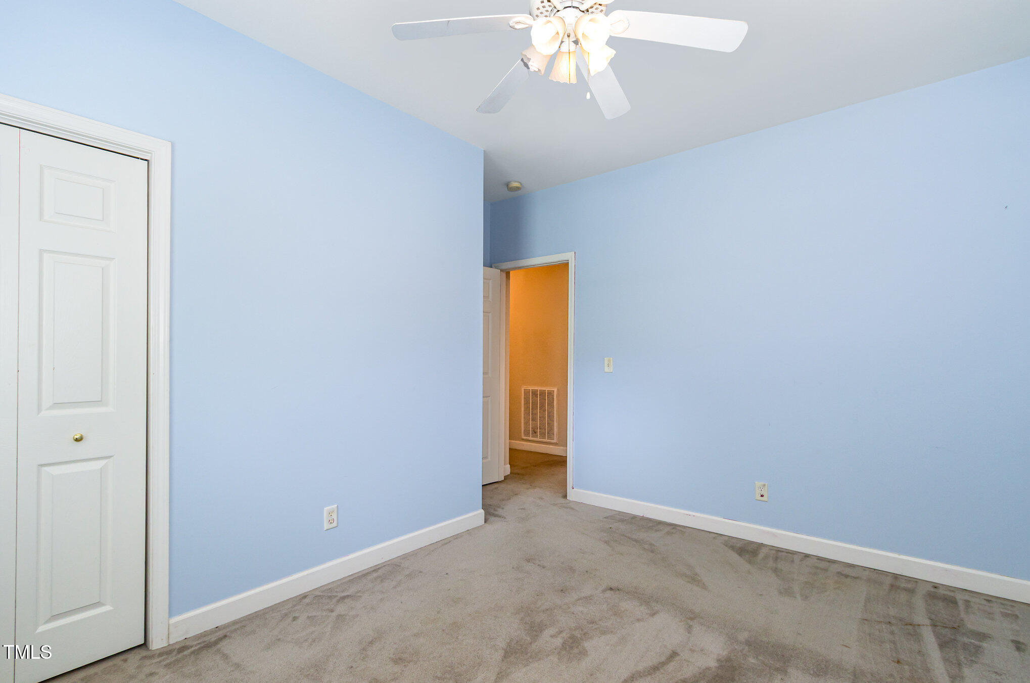 824 Kittrell Road Kittrell, NC 27544 - Photo 24 of 37 an empty room with a chandelier fan