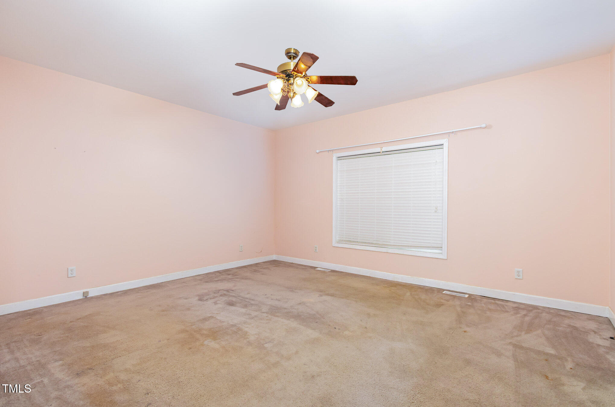 824 Kittrell Road Kittrell, NC 27544 - Photo 26 of 37 an empty room with windows and fan