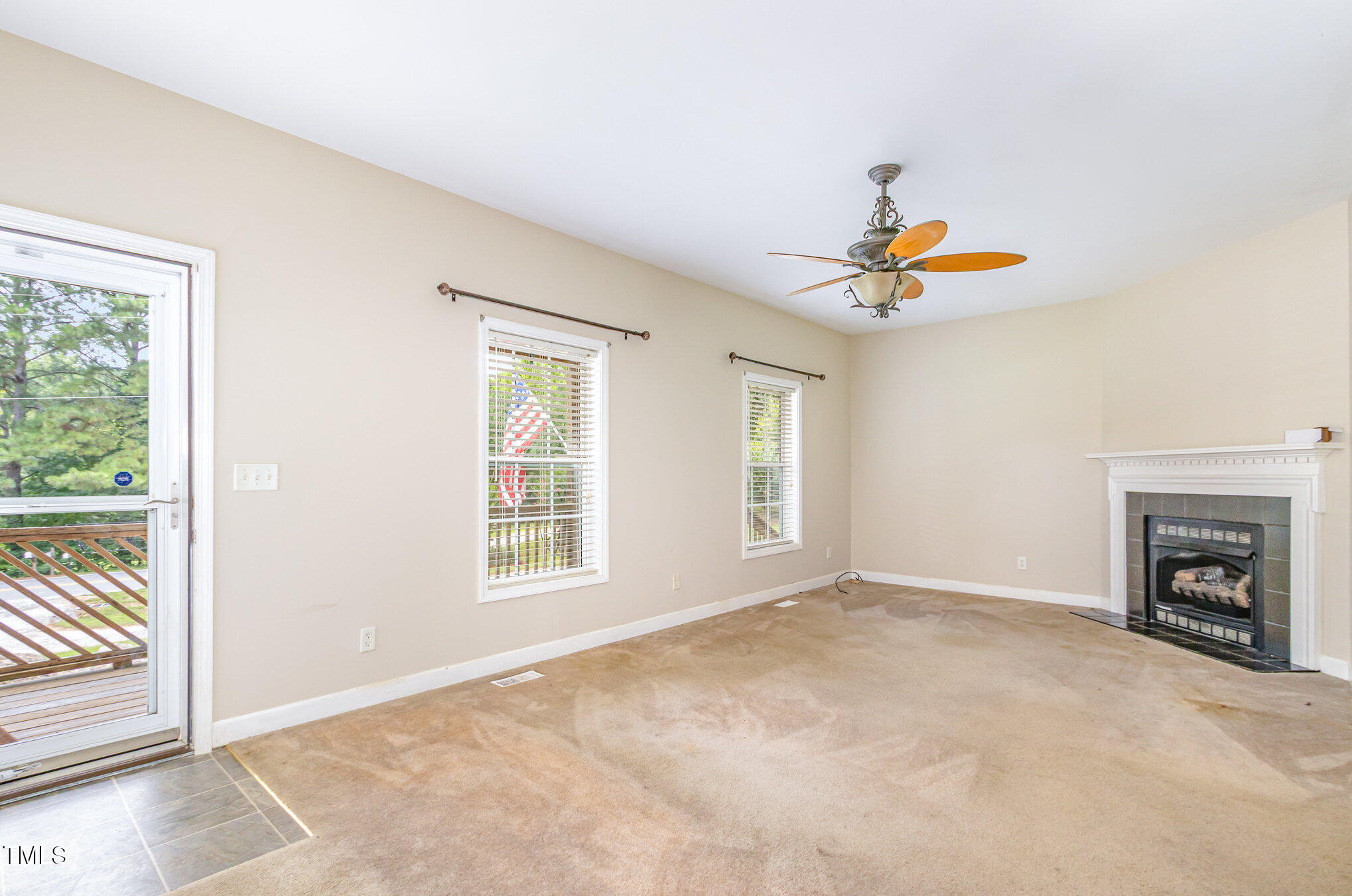 824 Kittrell Road Kittrell, NC 27544 - Photo 5 of 37 an empty room with windows and fireplace