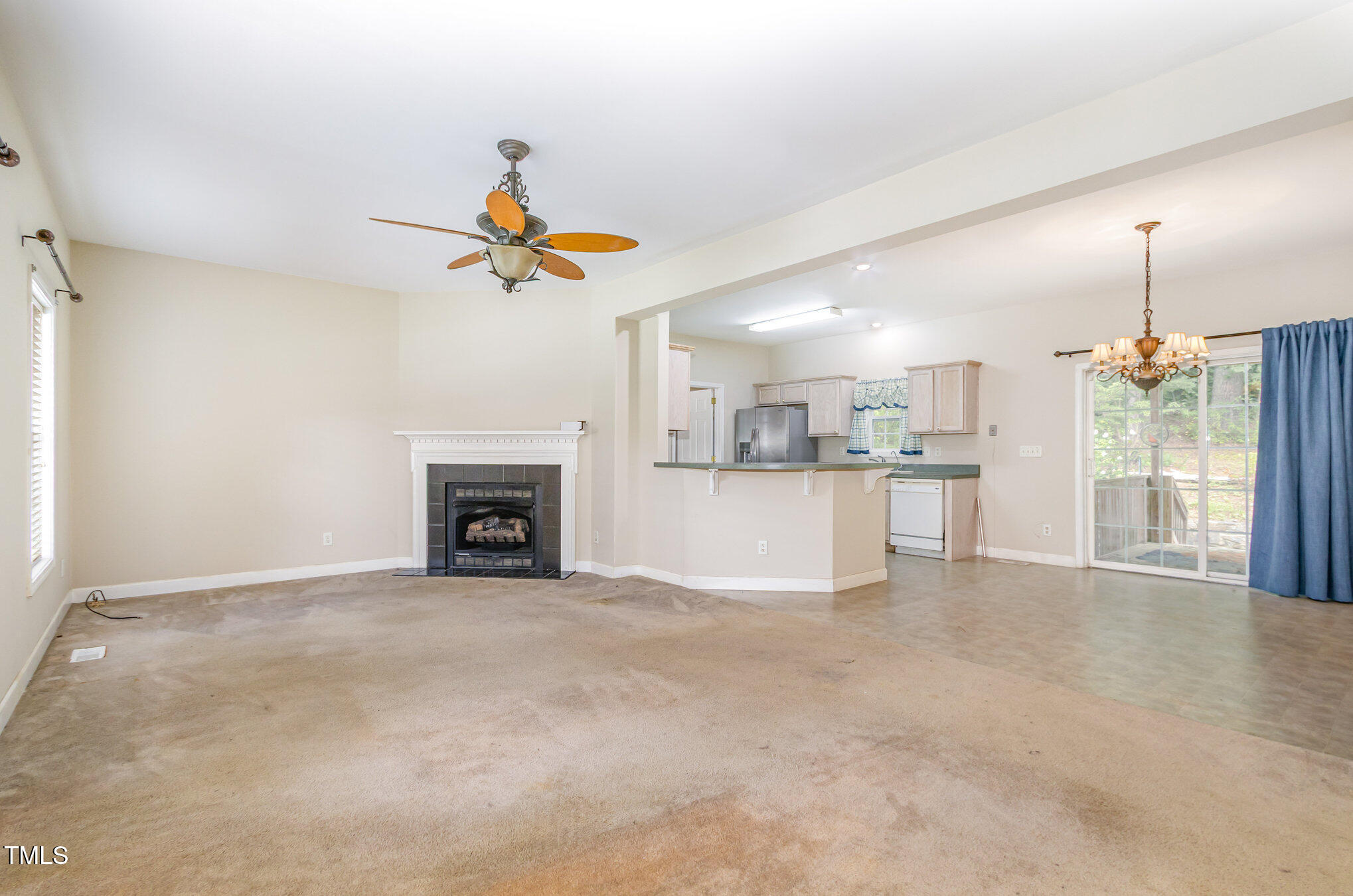 824 Kittrell Road Kittrell, NC 27544 - Photo 8 of 37 a view of a kitchen with a sink and a fireplace