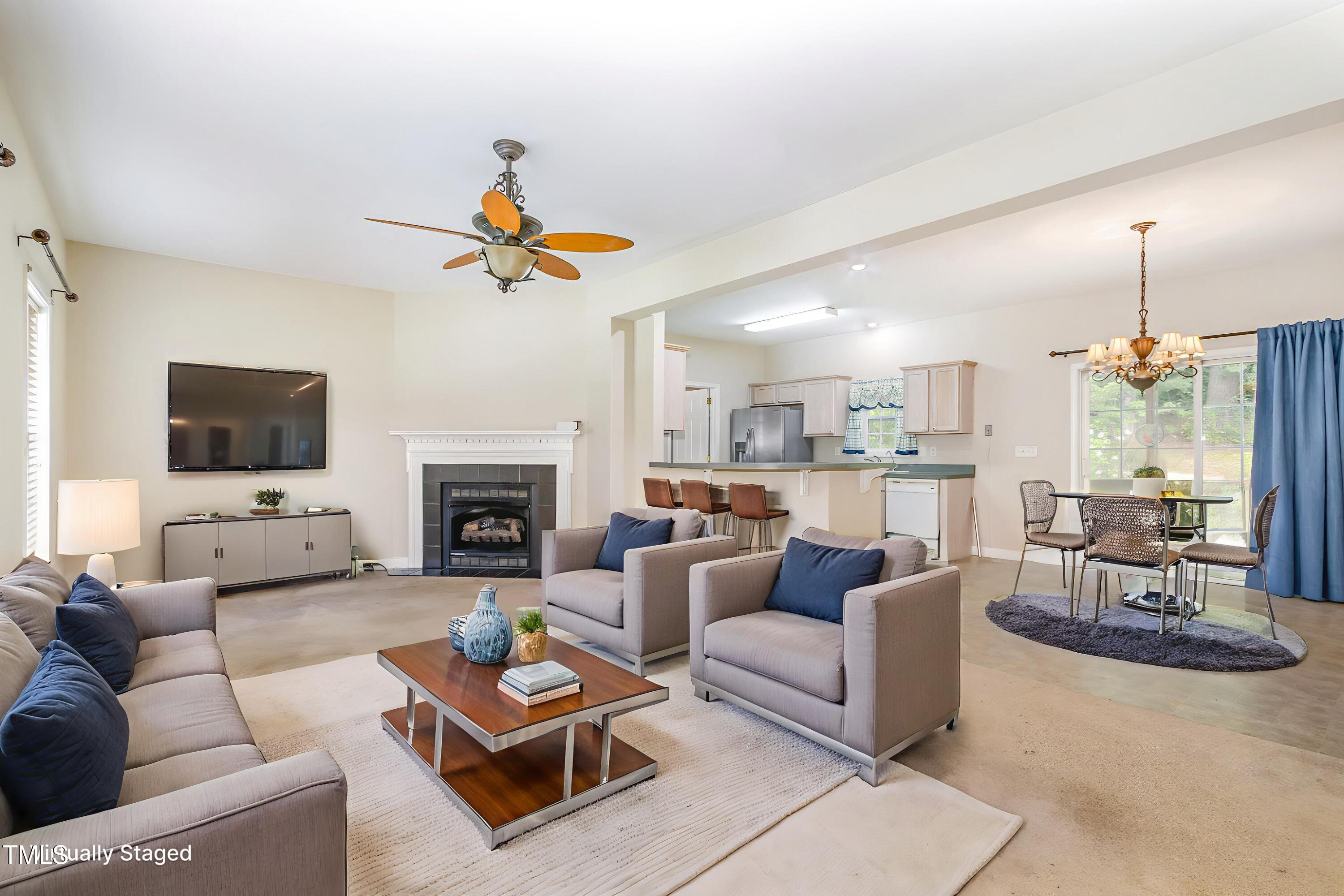 824 Kittrell Road Kittrell, NC 27544 - Photo 9 of 37 a living room with furniture a fireplace and a flat screen tv