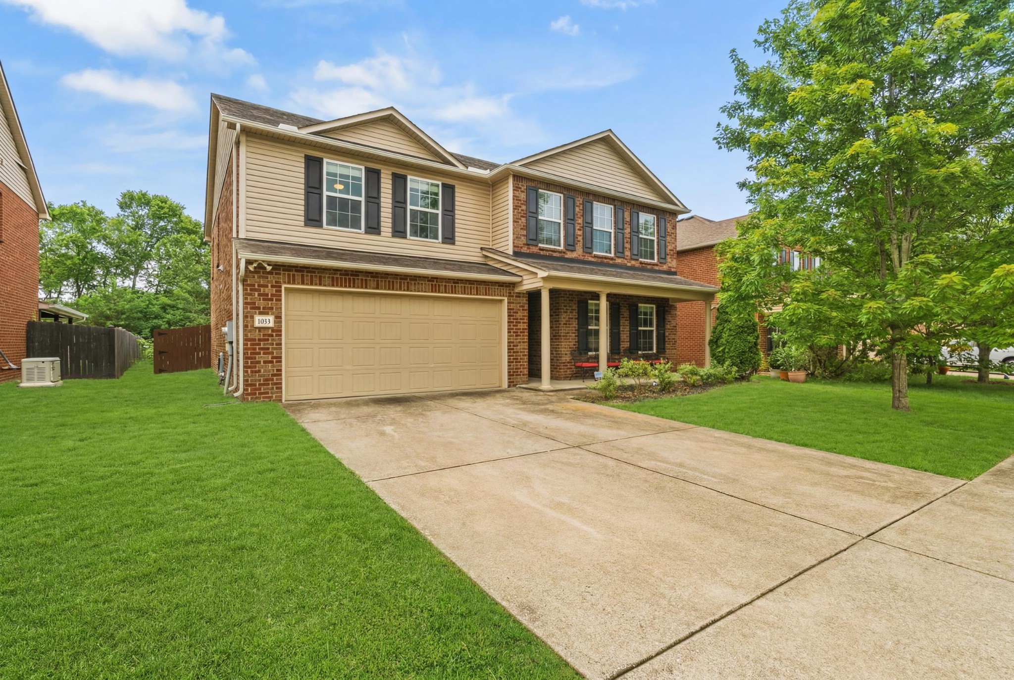 1011 Benwick Road Hendersonville, TN 37075 - Photo 7 of 60 a front view of a house with a yard and trees