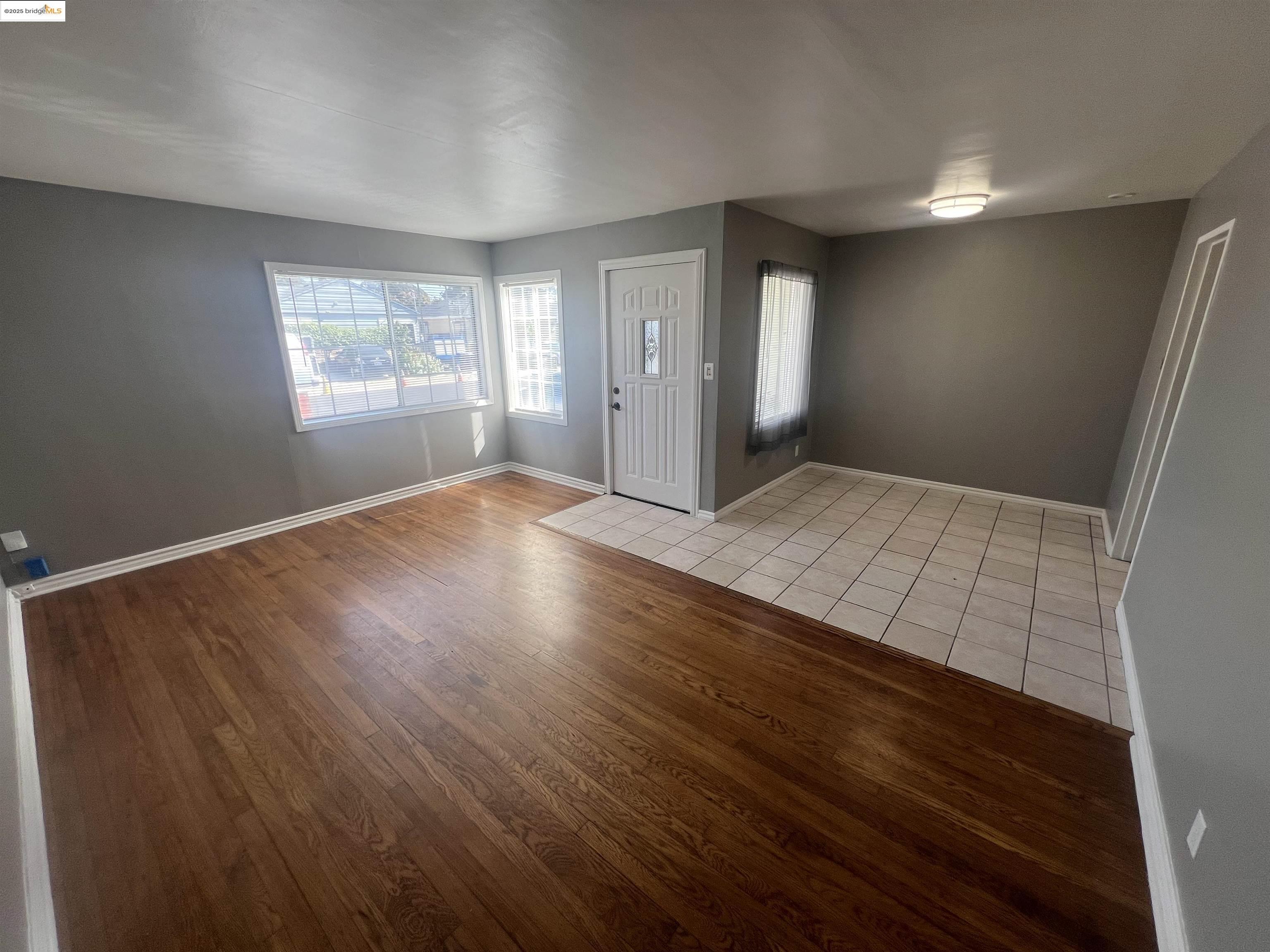 2923 Devon Way San Pablo, CA 94806 - Photo 5 of 11 wooden floor in an empty room with a window