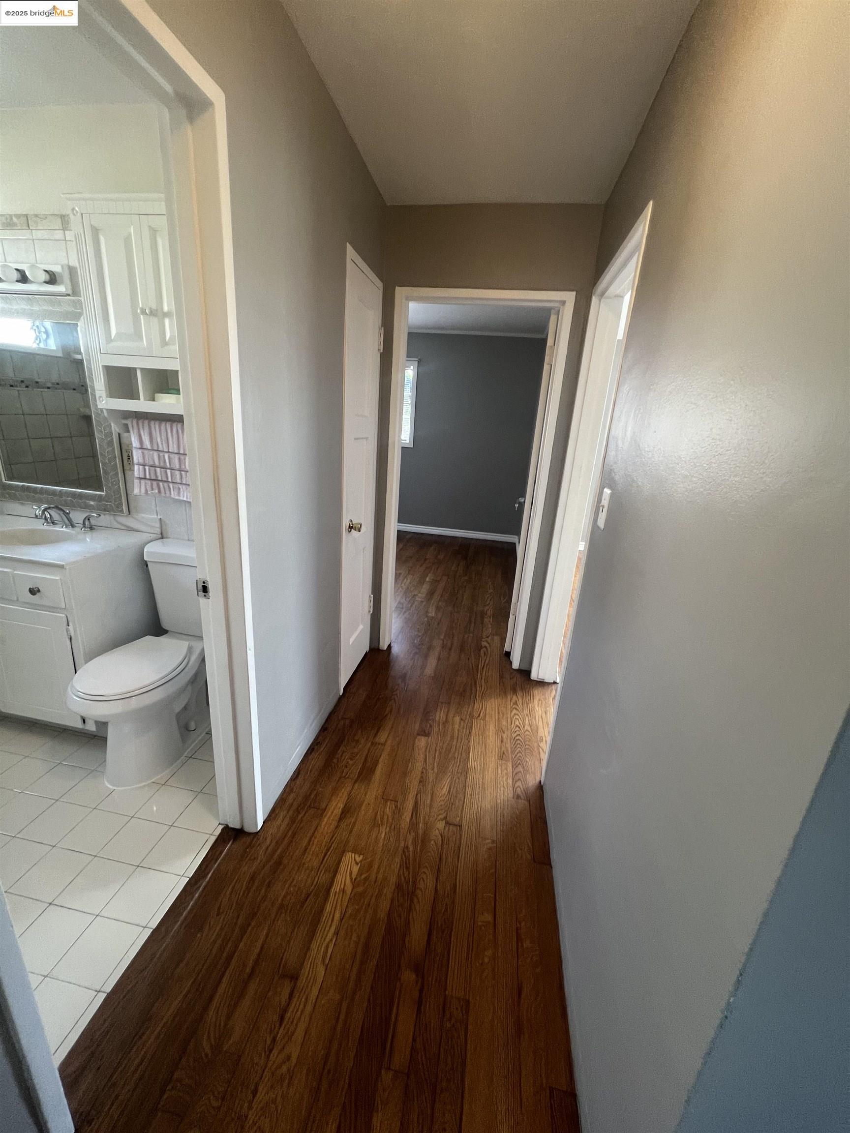 2923 Devon Way San Pablo, CA 94806 - Photo 6 of 11 a view of a hallway with wooden floor and furniture