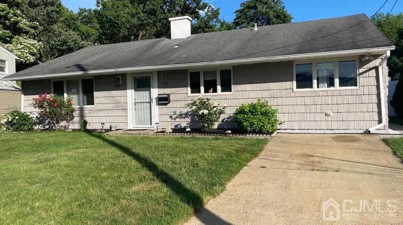 28 Baxter Road Edison, NJ 08817 - Photo 1 of 18 a front view of a house with a garden