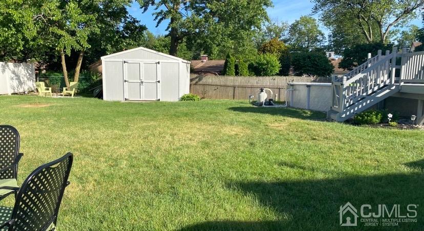 28 Baxter Road Edison, NJ 08817 - Photo 3 of 18 a view of backyard with a barn and large trees