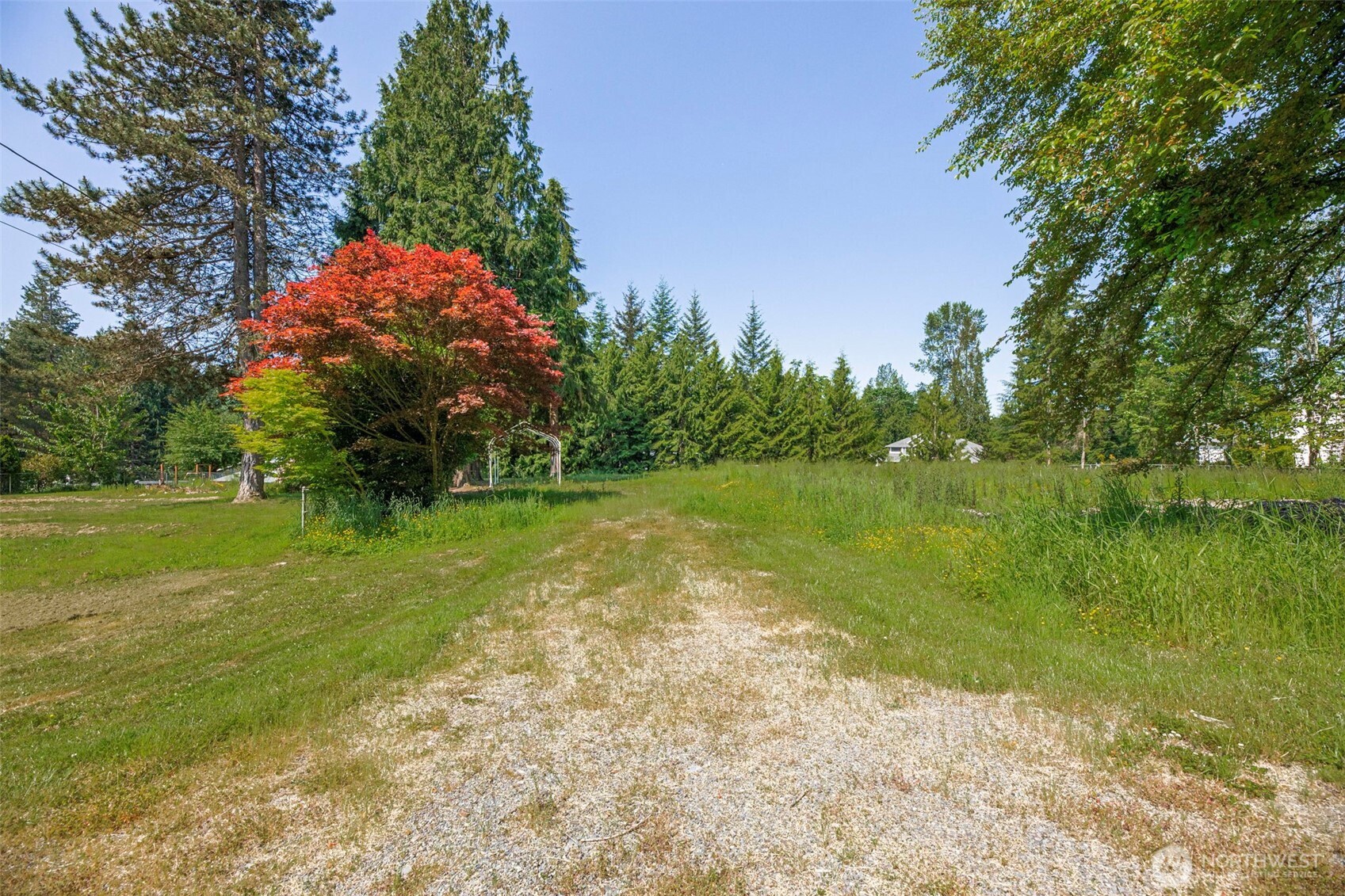 21022 Welch Road Snohomish, WA 98296 - Photo 1 of 28 a view of a lake with a yard