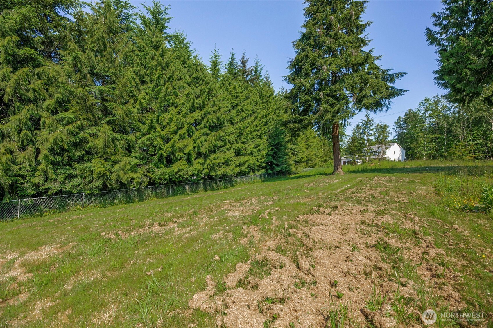 21022 Welch Road Snohomish, WA 98296 - Photo 14 of 28 a view of a lake with a yard