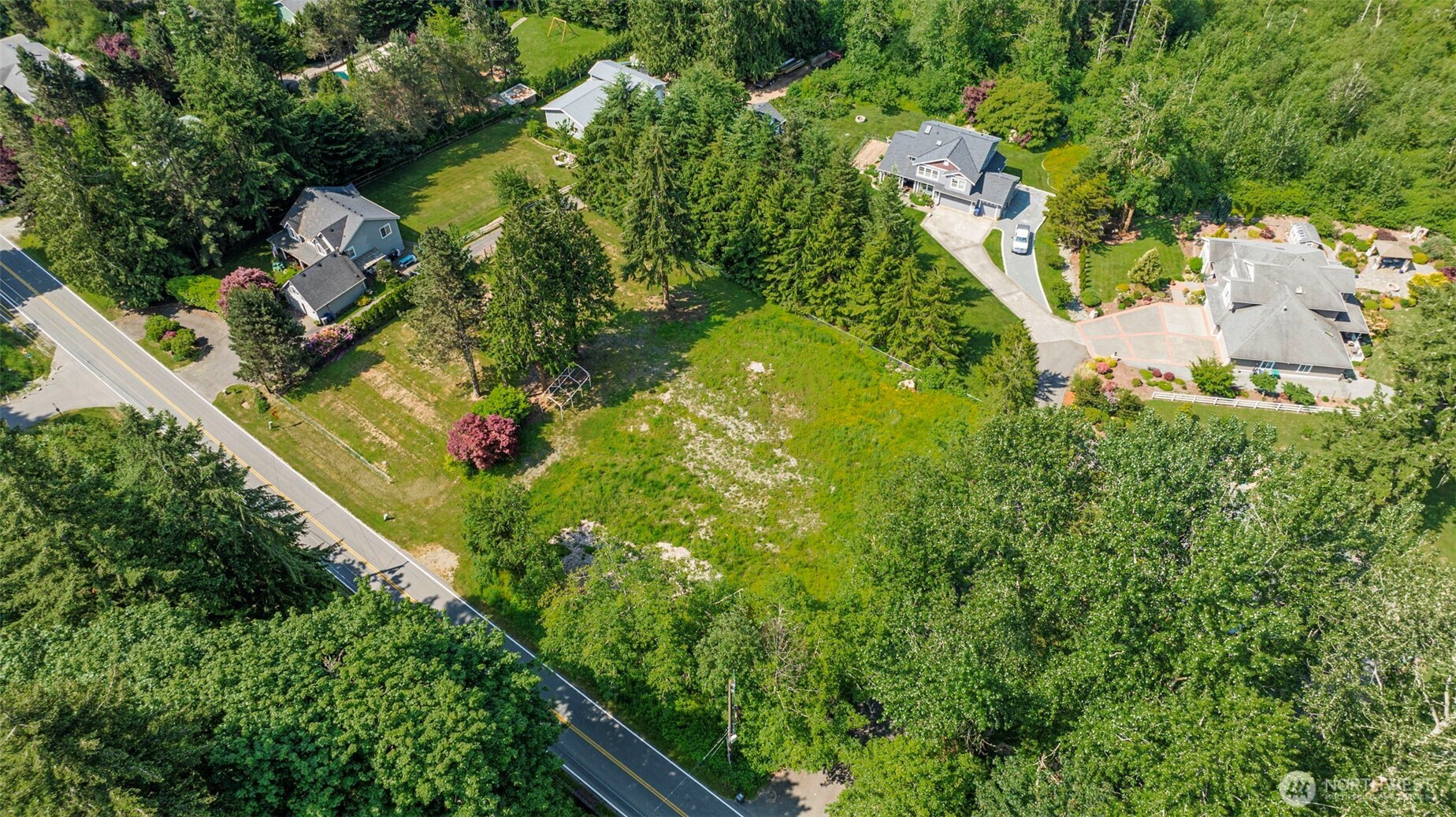 21022 Welch Road Snohomish, WA 98296 - Photo 25 of 28 an aerial view of a house with a yard swimming pool and outdoor seating