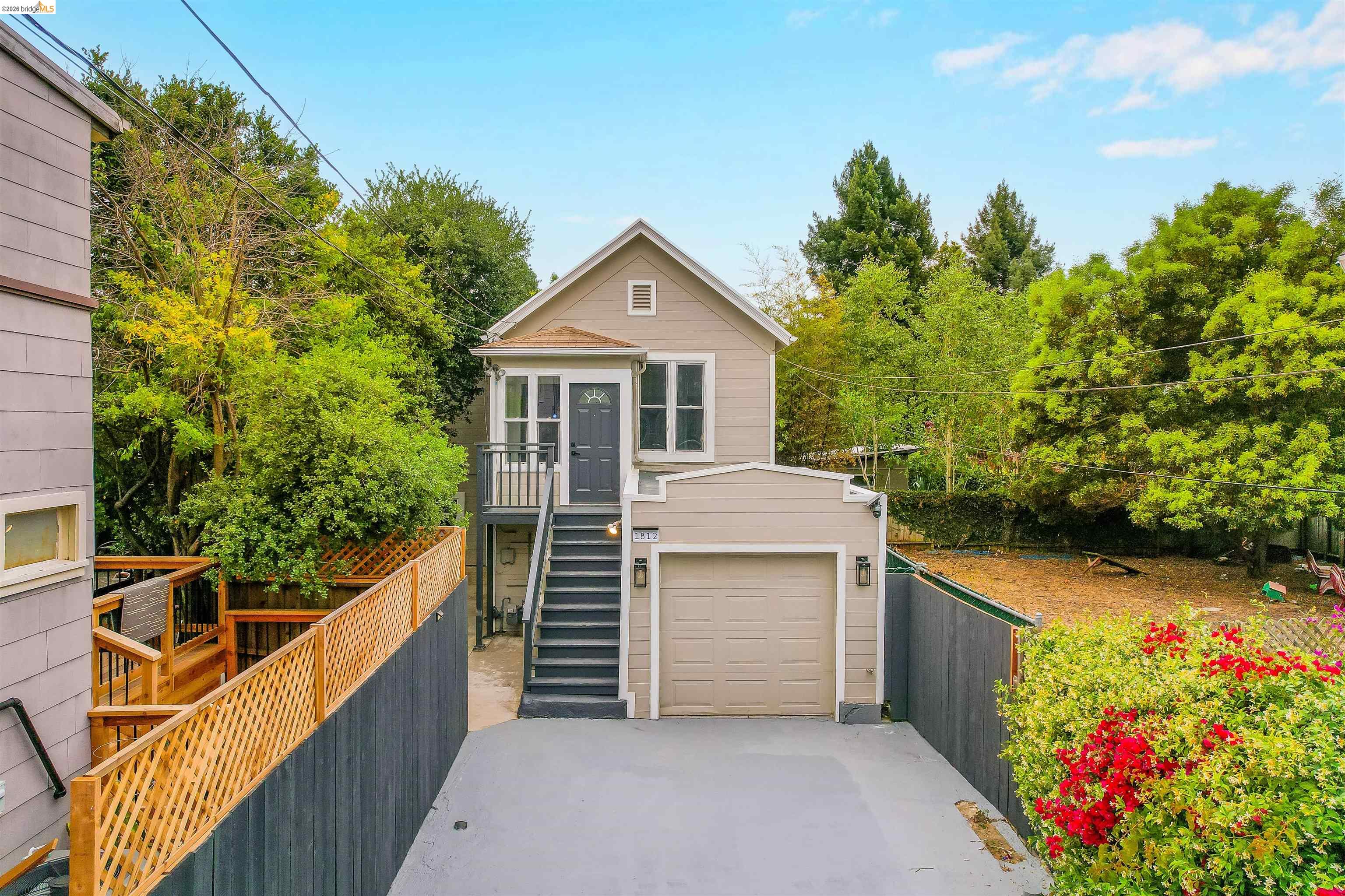 1812 Woolsey Street Berkeley, CA 94703 - Photo 46 of 48 Two-story residence with an attached garage, featuring a second-level entry balcony and exterior stairs