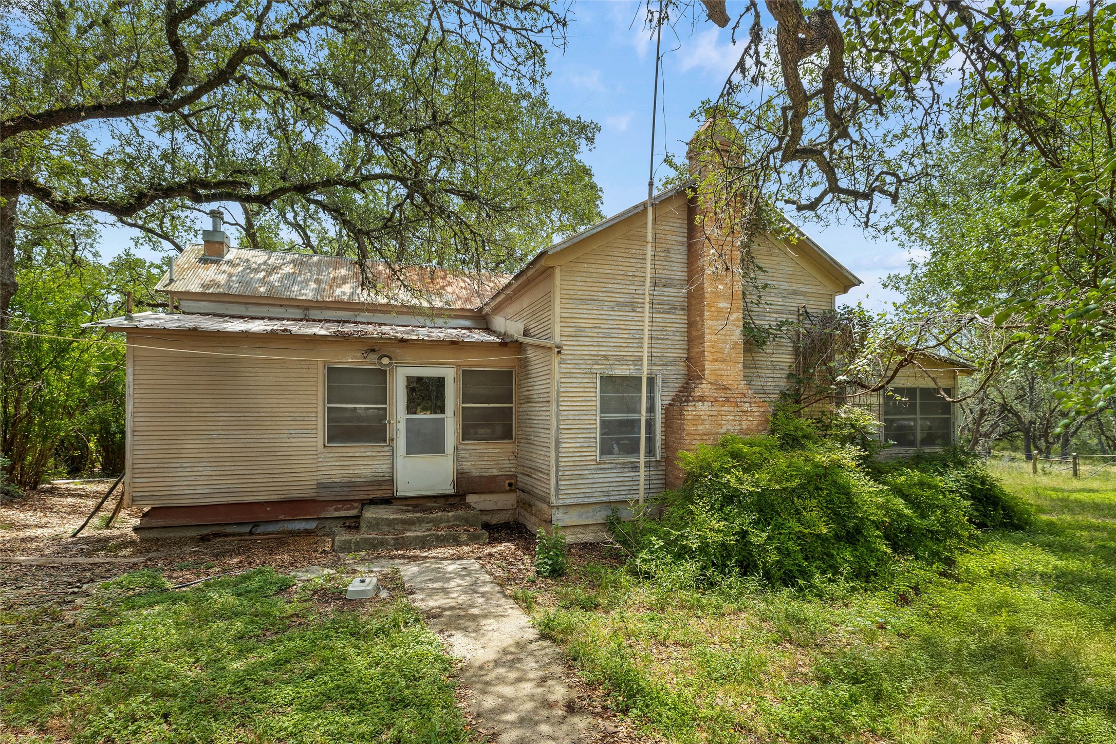 1128 Posey Ranch Road Fischer, TX 78623 - Photo 8 of 39 front view of a house with a yard