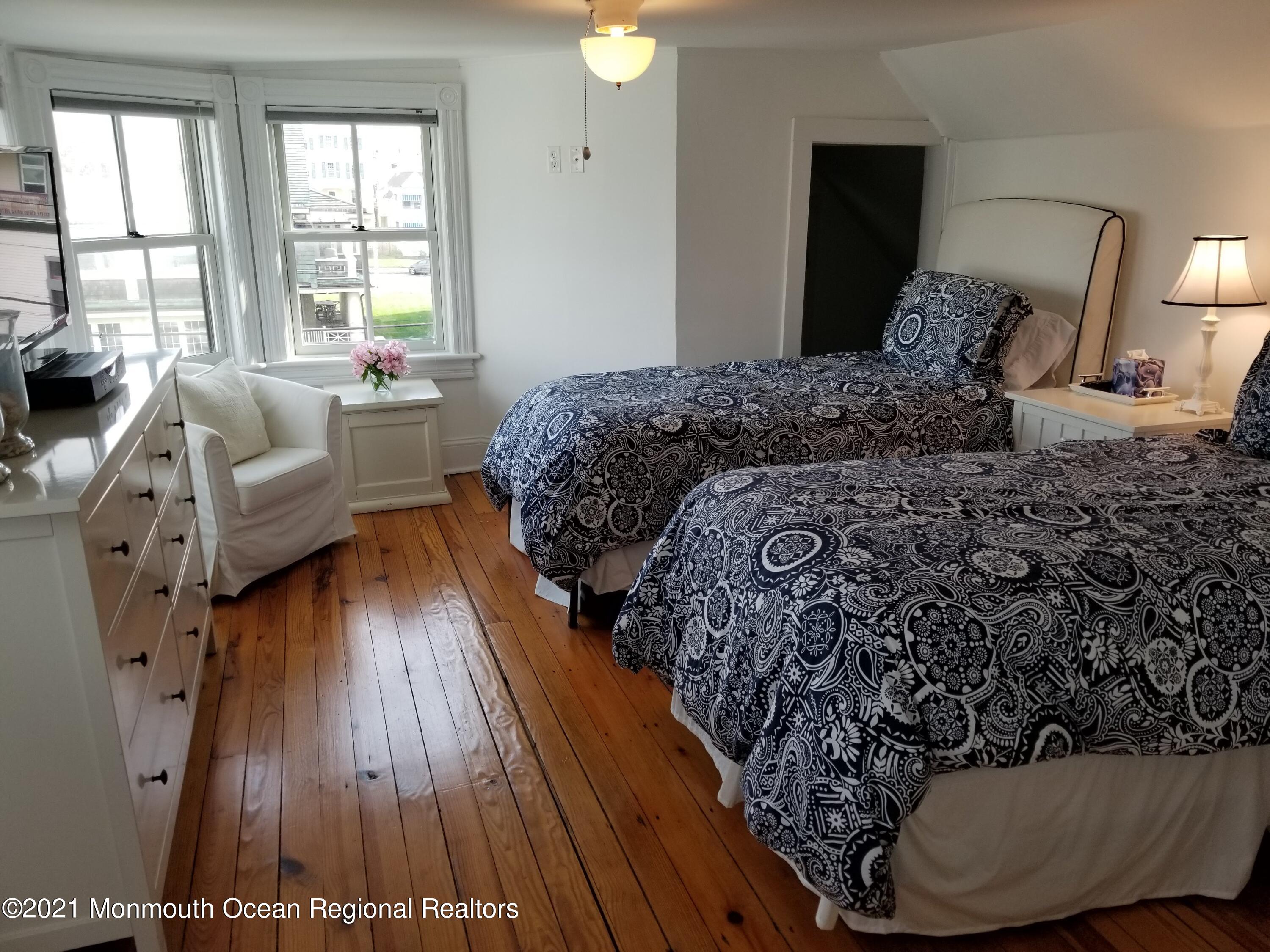 6 Heck Avenue Ocean Grove, NJ 07756 - Photo 13 of 14 a bed sitting in a bedroom next to a window