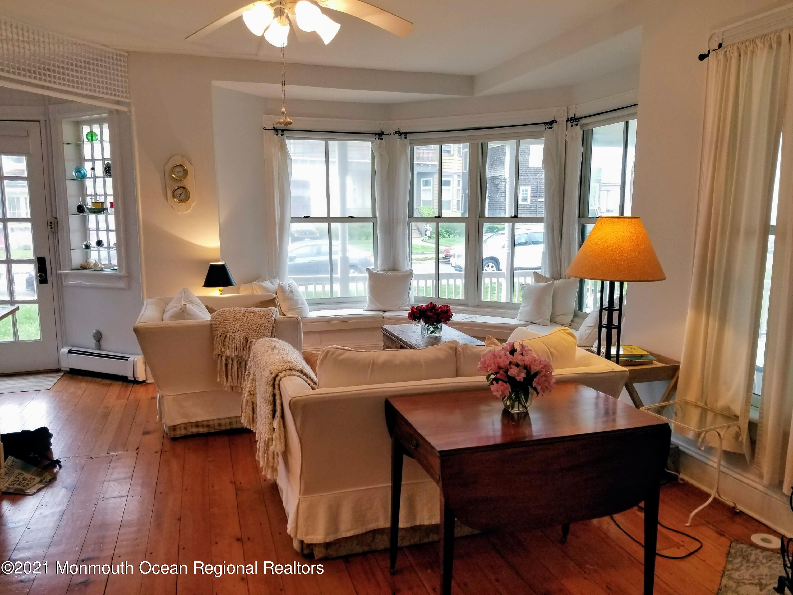 6 Heck Avenue Ocean Grove, NJ 07756 - Photo 4 of 14 a living room with furniture and a window