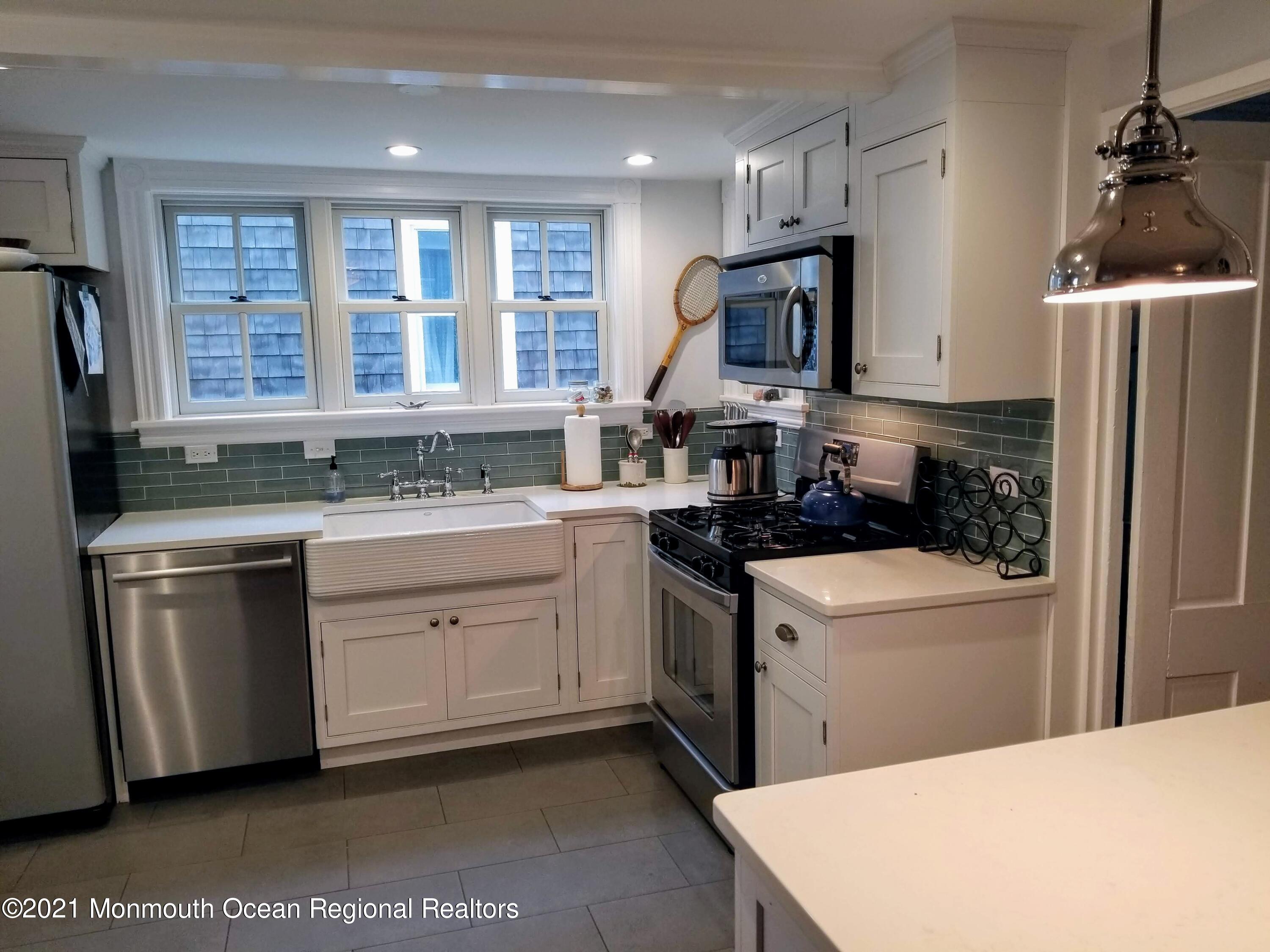 6 Heck Avenue Ocean Grove, NJ 07756 - Photo 8 of 14 a kitchen with a sink stove and refrigerator